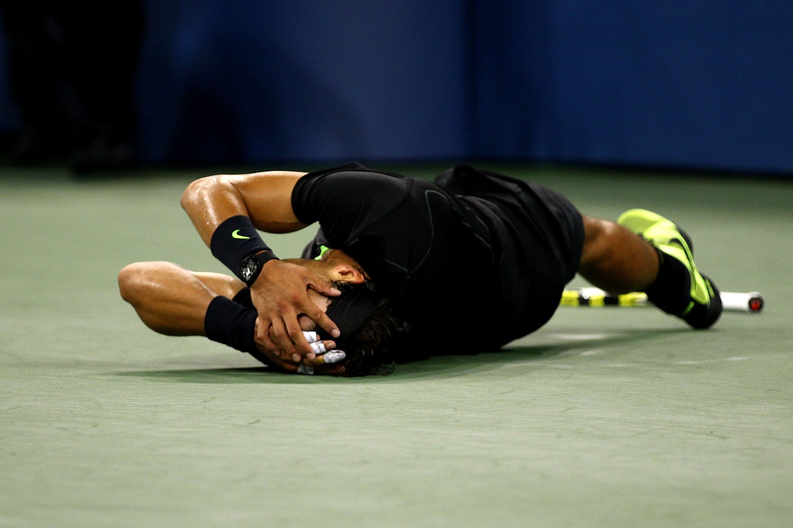 NEW YORK - SEPTEMBER 13: Rafael Nadal of Spain rolls on the ground in celebration of his win over Novak Djokovic of Serbia during the men's singles final on day fifteen of the 2010 U.S. Open at the USTA Billie Jean King National Tennis Center on Septembe NEW YORK - SEPTEMBER 13: Rafael Nadal of Spain rolls on the ground in celebration of his win over Novak Djokovic of Serbia during the men's singles final on day fifteen of the 2010 U.S. Open at the USTA Billie Jean King National Tennis Center on Septembe