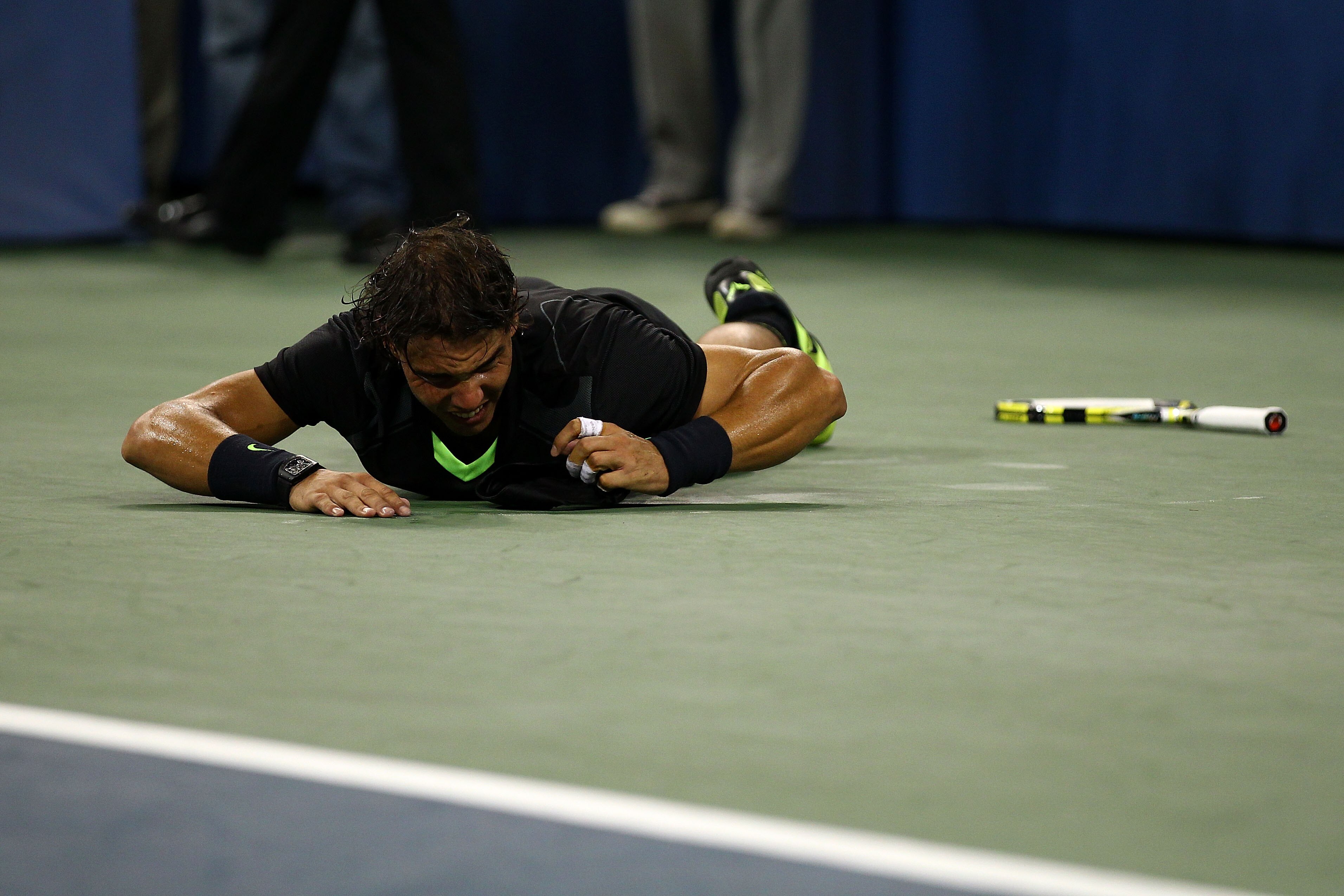 NEW YORK - SEPTEMBER 13:  Rafael Nadal of Spain rolls on the ground in celebration of his win over Novak Djokovic of Serbia during their men's singles final on day fifteen of the 2010 U.S. Open at the USTA Billie Jean King National Tennis Center on Septem