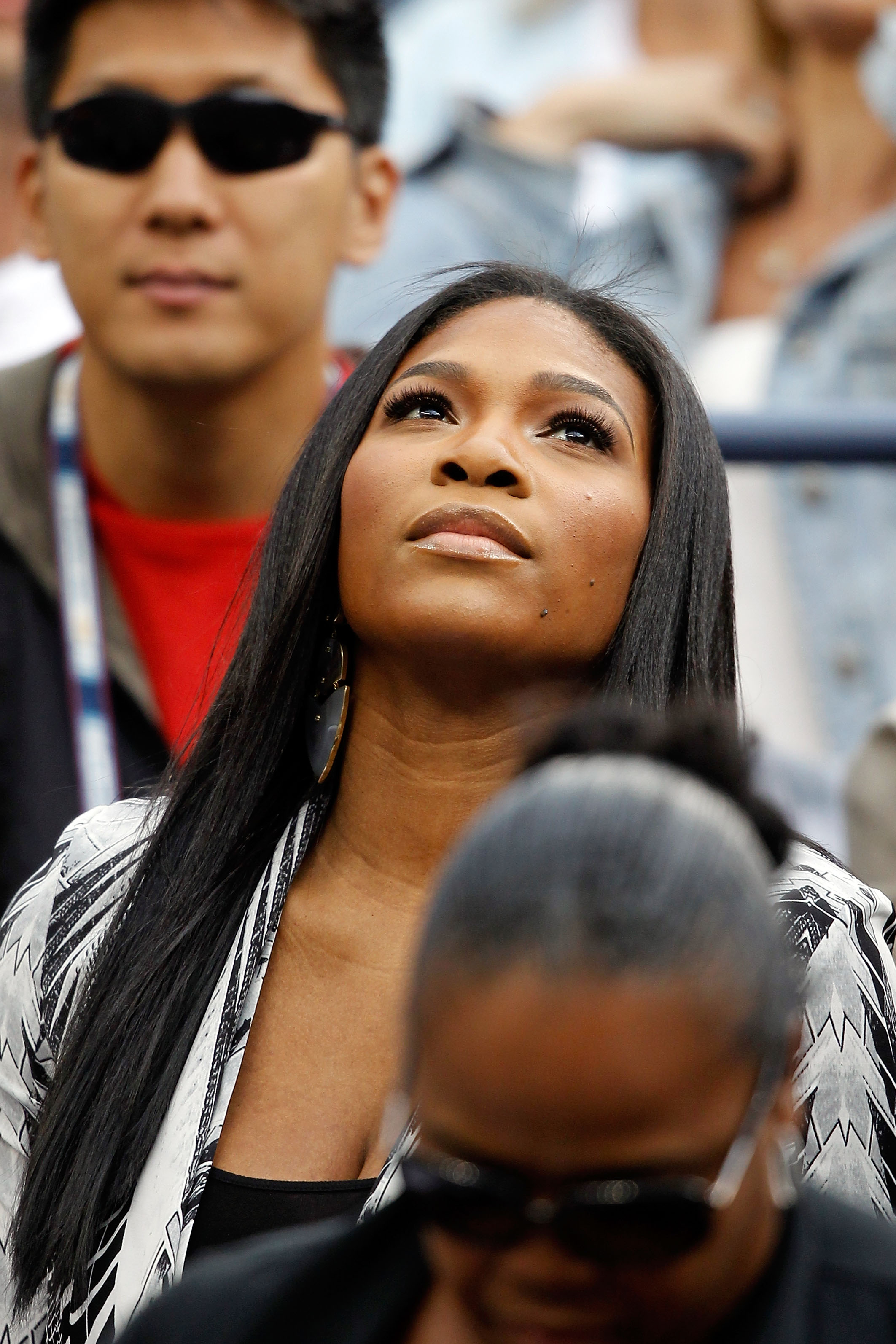 NEW YORK - SEPTEMBER 10:  Serena Williams watches as her sister Venus Williams of the United States plays against Kim Clijsters of Belgium during her women's semifinal match on day twelve of the 2010 U.S. Open at the USTA Billie Jean King National Tennis