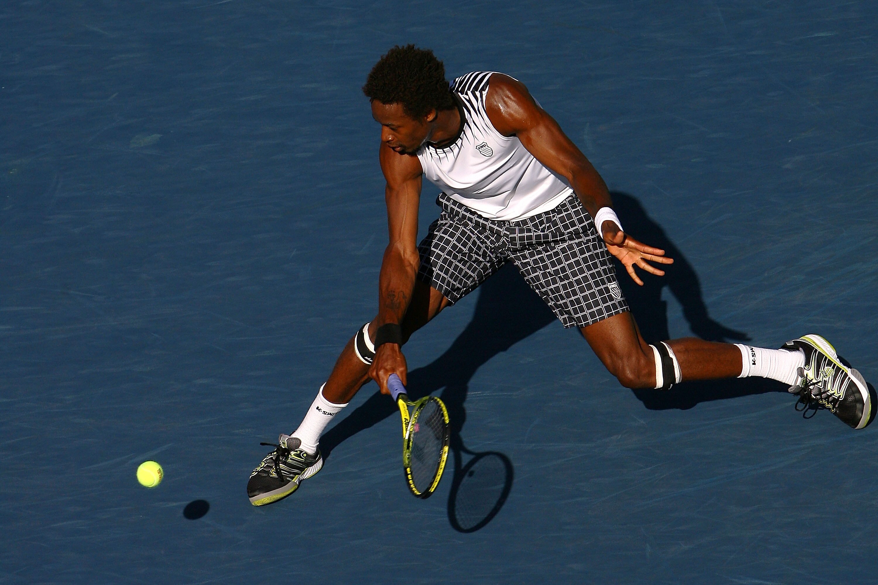 NEW YORK - SEPTEMBER 08:  Gael Monfils of France hits a return against Novak Djokovic of Serbia during his men's singles quarterfinal match on day ten of the 2010 U.S. Open at the USTA Billie Jean King National Tennis Center on September 8, 2010 in the Fl