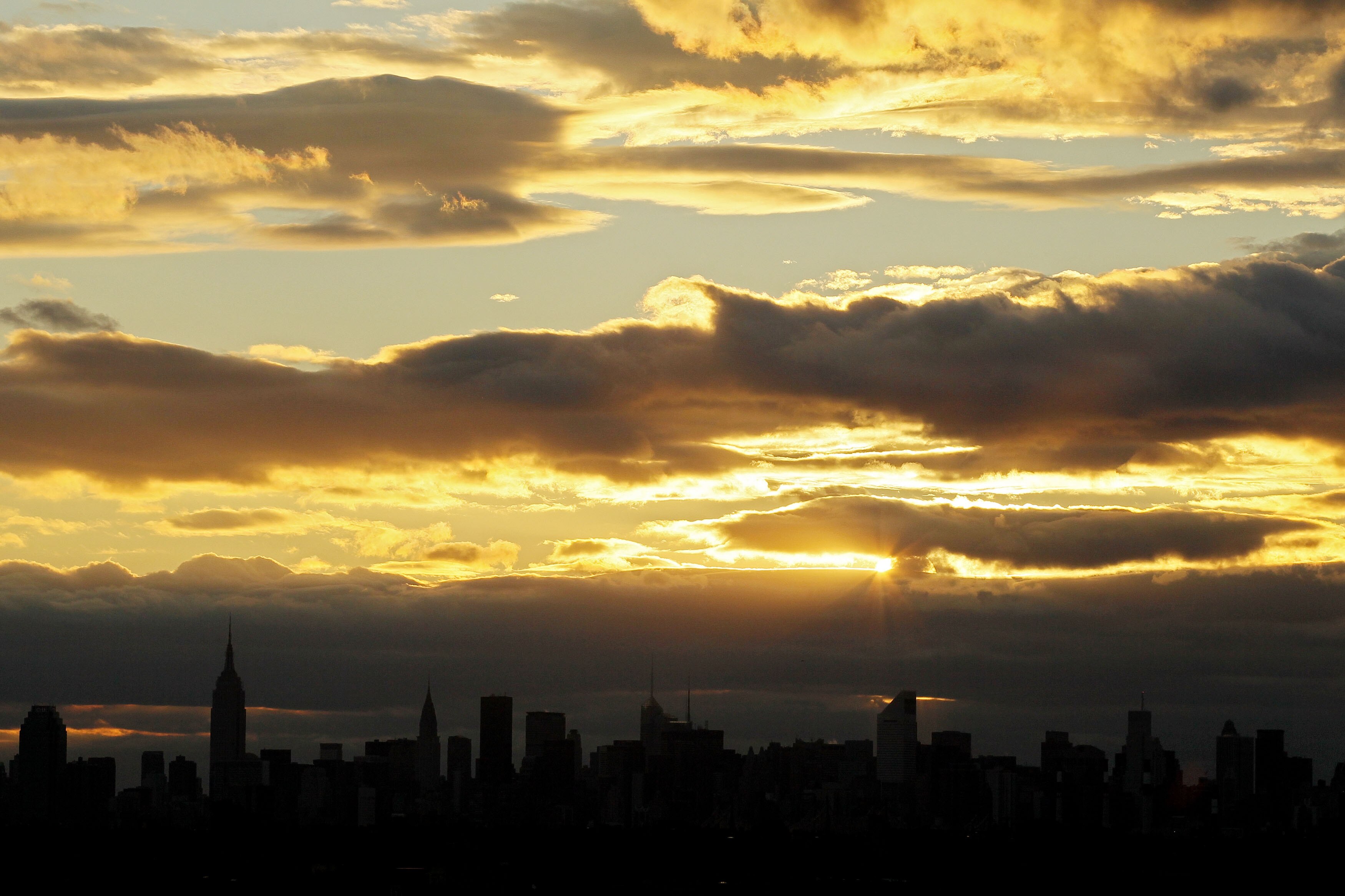NEW YORK - SEPTEMBER 09:  The sunsets over the Manhattan skyline during day eleven of the 2010 U.S. Open at the USTA Billie Jean King National Tennis Center on September 9, 2010 in the Flushing neighborhood of the Queens borough of New York City.  (Photo