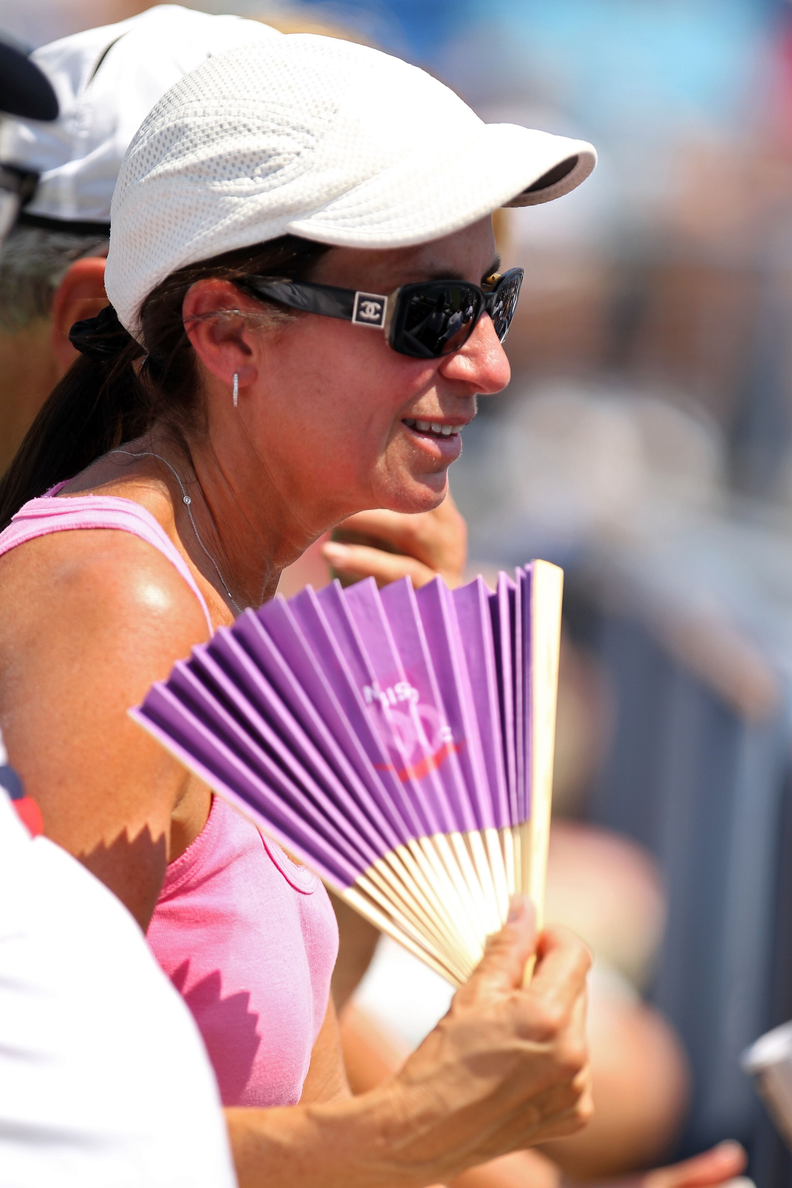 NEW YORK - AUGUST 31: A spectator fans herself during day two of the 2010 U.S. Open at the USTA Billie Jean King National Tennis Center on August 31, 2010 in the Flushing neighborhood of the Queens borough of New York City. (Photo by Al Bello/Getty Imag NEW YORK - AUGUST 31: A spectator fans herself during day two of the 2010 U.S. Open at the USTA Billie Jean King National Tennis Center on August 31, 2010 in the Flushing neighborhood of the Queens borough of New York City. (Photo by Al Bello/Getty Imag