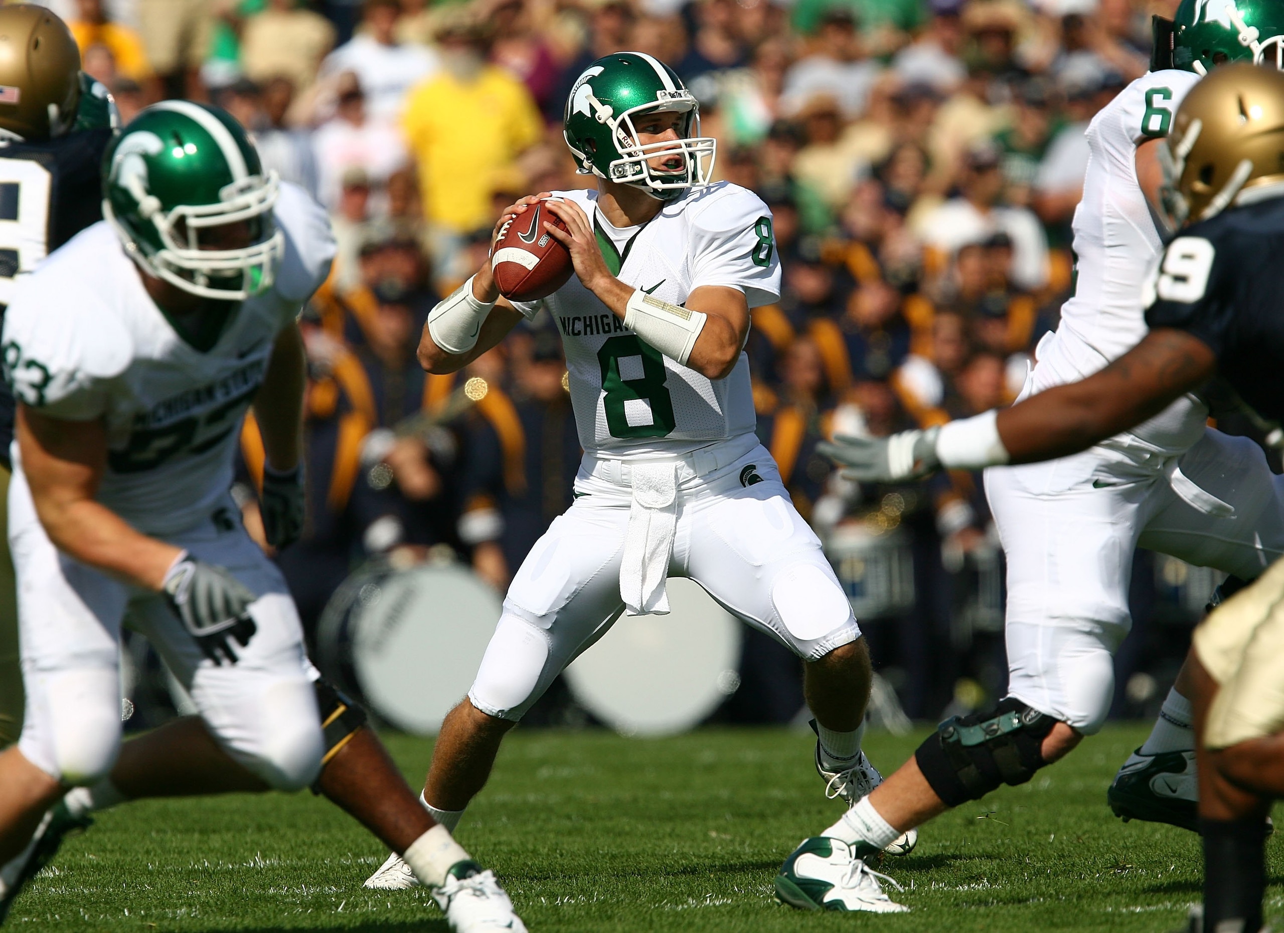 SOUTH BEND, IN - SEPTEMBER 19: Kirk Cousins #8 of the Michigan State Spartans looks for a receiver against the Notre Dame Fighting Irish on September 19, 2009 at Notre Dame Stadium in South Bend, Indiana. Notre Dame defeated Michigan State 33-30.  (Photo