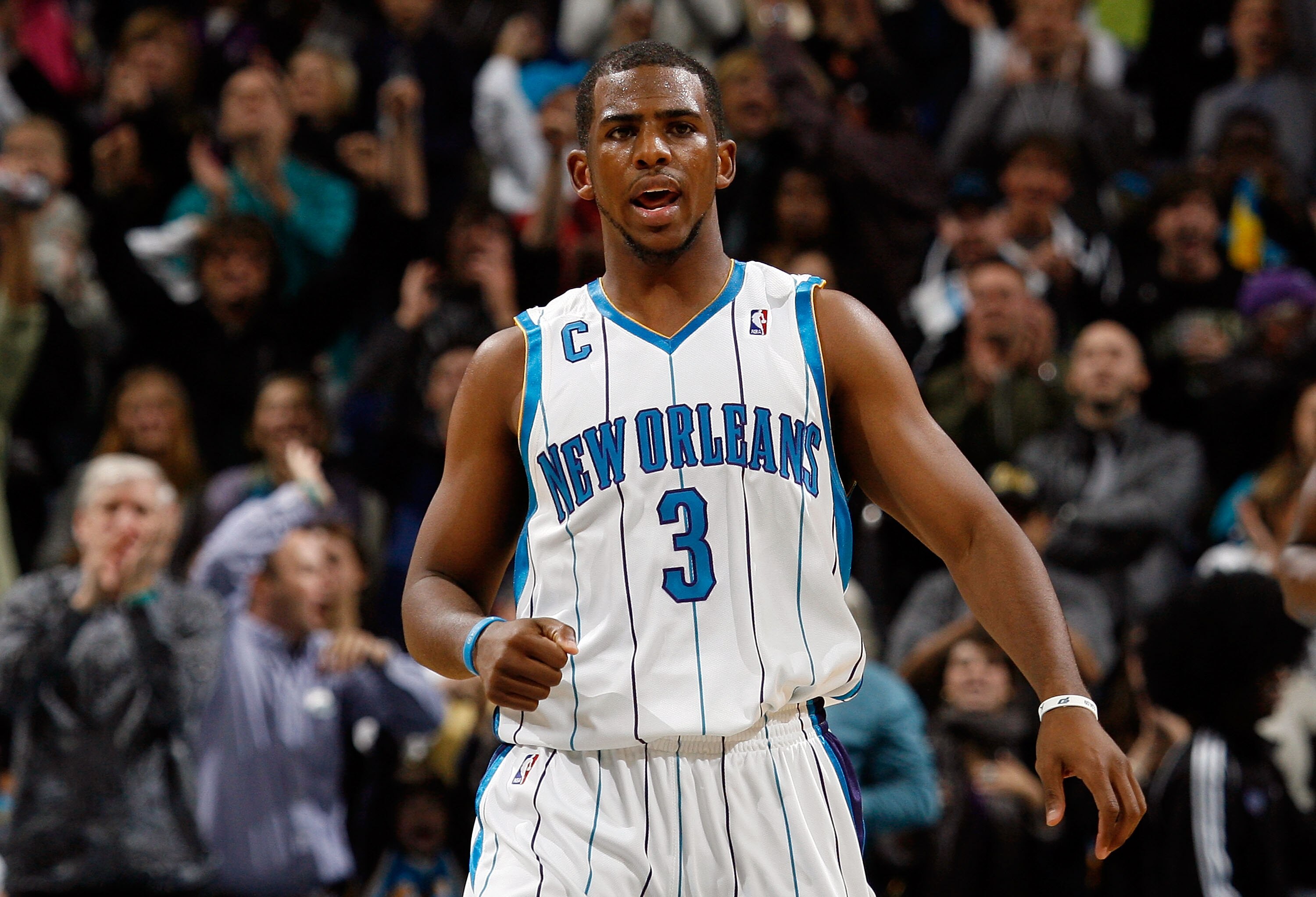 NEW ORLEANS, LA - JANUARY 02:  Chris Paul #3 of the New Orleans Hornets celebrates after defeating  the Houston Rockets 95-99 at the New Orleans Arena on January 2, 2010 in New Orleans, Louisiana.  NOTE TO USER: User expressly acknowledges and agrees that