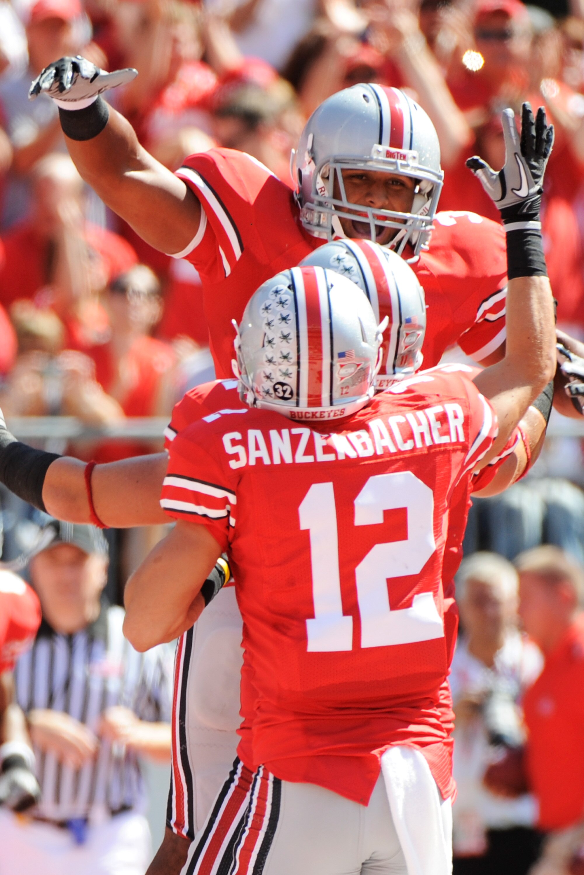 COLUMBUS, OH - SEPTEMBER 18:  Brandon Saine #3 of the Ohio State Buckeyes celebrates his first quarter touchdown against the Ohio Bobcats with Dane Sanzenbacher #12 of the Ohio State Buckeyes at Ohio Stadium on September 18, 2010 in Columbus, Ohio.  (Phot