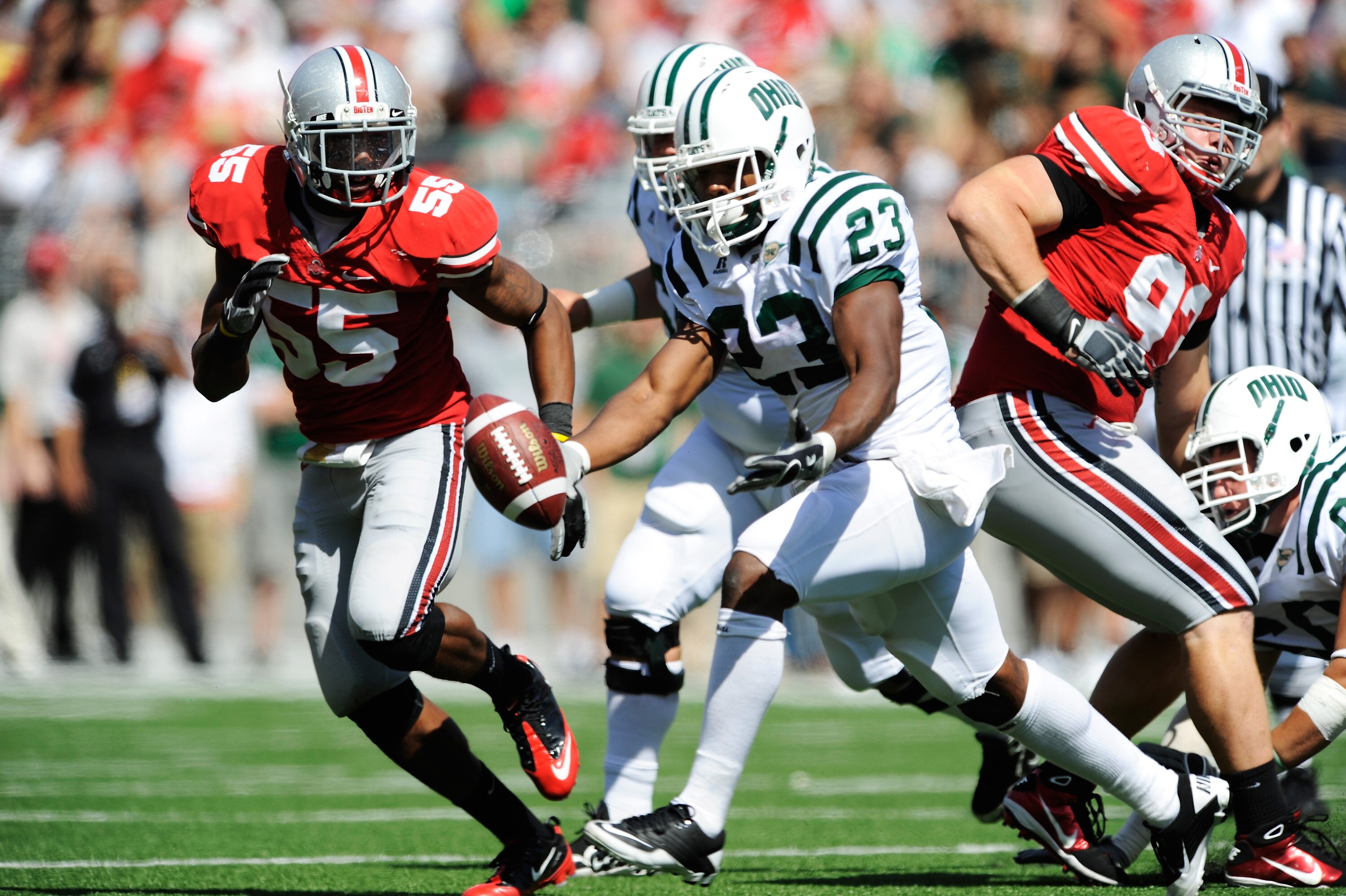 COLUMBUS, OH - SEPTEMBER 18:  Running back Dallas Brown #23 of the Ohio Bobcats fumbles the ball as he is pursued by Jonathan Newsome #55 of the Ohio State Buckeyes at Ohio Stadium on September 18, 2010 in Columbus, Ohio. Brown recovered his own fumble.
