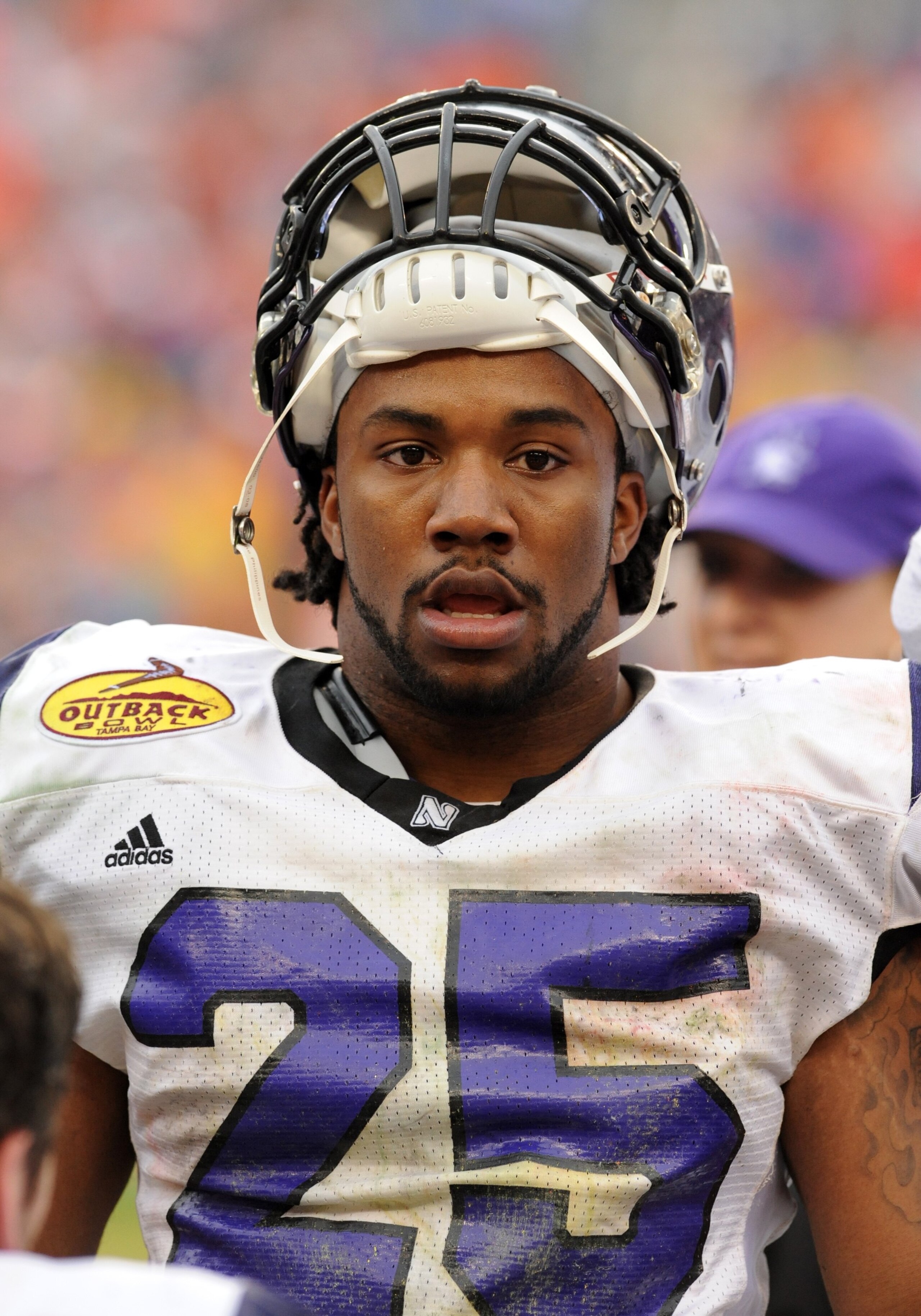TAMPA, FL - JANUARY 1: Running back Stephen Simmons #25 of the Northwestern Wildcats watches play against the Auburn Tigers in the Outback Bowl January 1, 2010 at Raymond James Stadium in Tampa, Florida.  (Photo by Al Messerschmidt/Getty Images)
