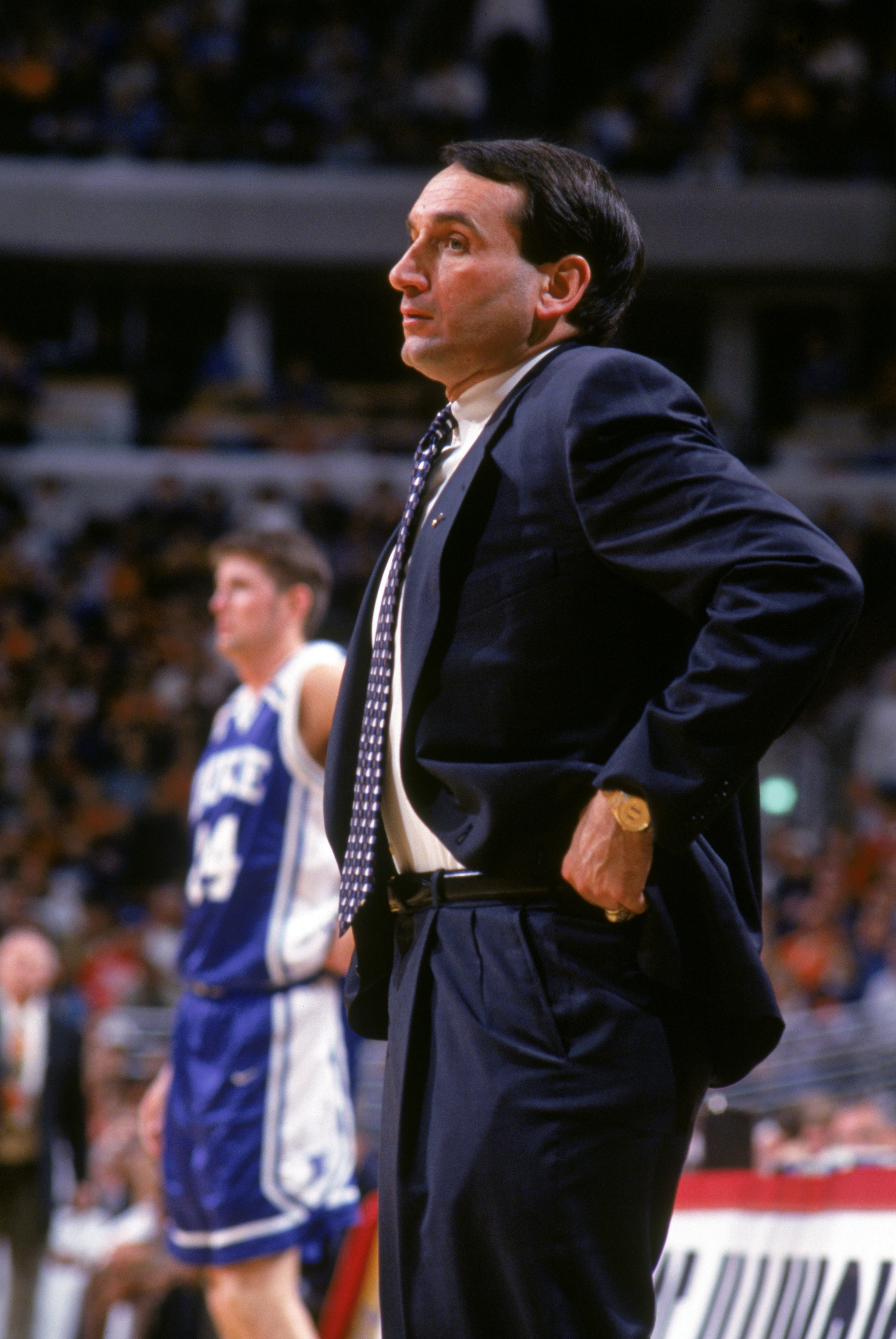 CHICAGO - DECEMBER 3:  Head coach Mike Krzyzewski of the Duke University Blue Devils watches the action from the sidelines during a NCAA game against the University of Illinois Fighting Illini at the United Center on December 3, 1994 in Chicago Illinois. 