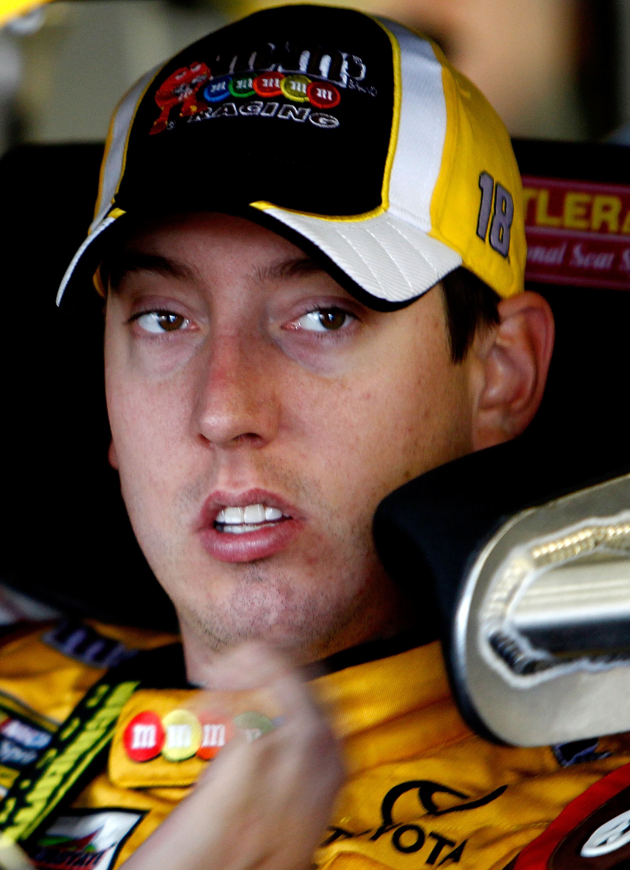LOUDON, NH - SEPTEMBER 17:  Kyle Busch, driver of the #18 M&M's Toyota, looks on during practice for the NASCAR Sprint Cup Series Sylvania 300 at New Hampshire Motor Speedway on September 17, 2010 in Loudon, New Hampshire.  (Photo by Jeff Zelevansky/Getty