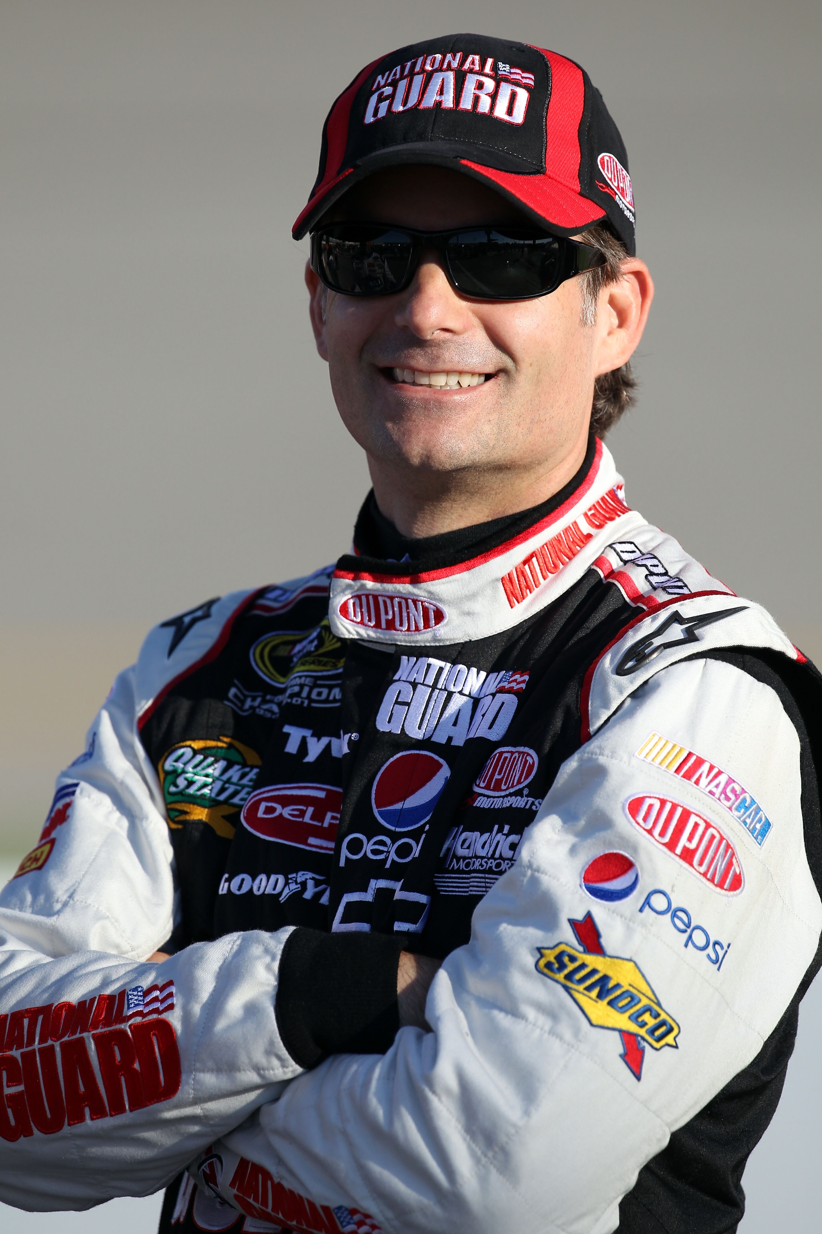 RICHMOND, VA - SEPTEMBER 10:  Jeff Gordon, driver of the #24 DuPont/National Guard Chevrolet, stands on the grid during qualifying for the NASCAR Sprint Cup Series Air Guard 400 at Richmond International Raceway on September 10, 2010 in Richmond, Virginia