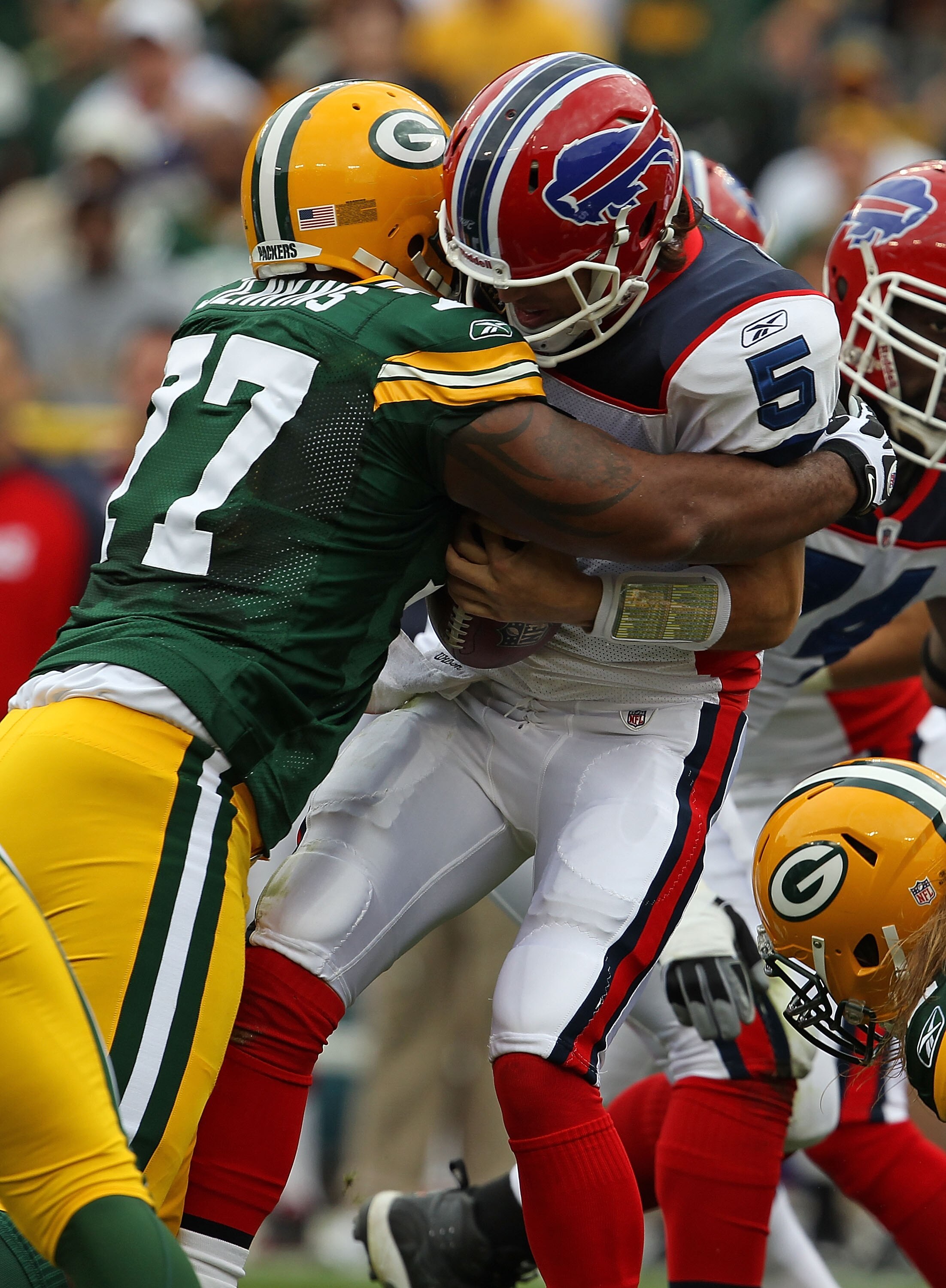 GREEN BAY, WI - SEPTEMBER 19: Cullen Jenkins #77 of the Green Bay Packers sacks Trent Edwards #5 of the Buffalo Bills at Lambeau Field on September 19, 2010 in Green Bay, Wisconsin. The Packers defeated the Bills 34-7. (Photo by Jonathan Daniel/Getty Imag