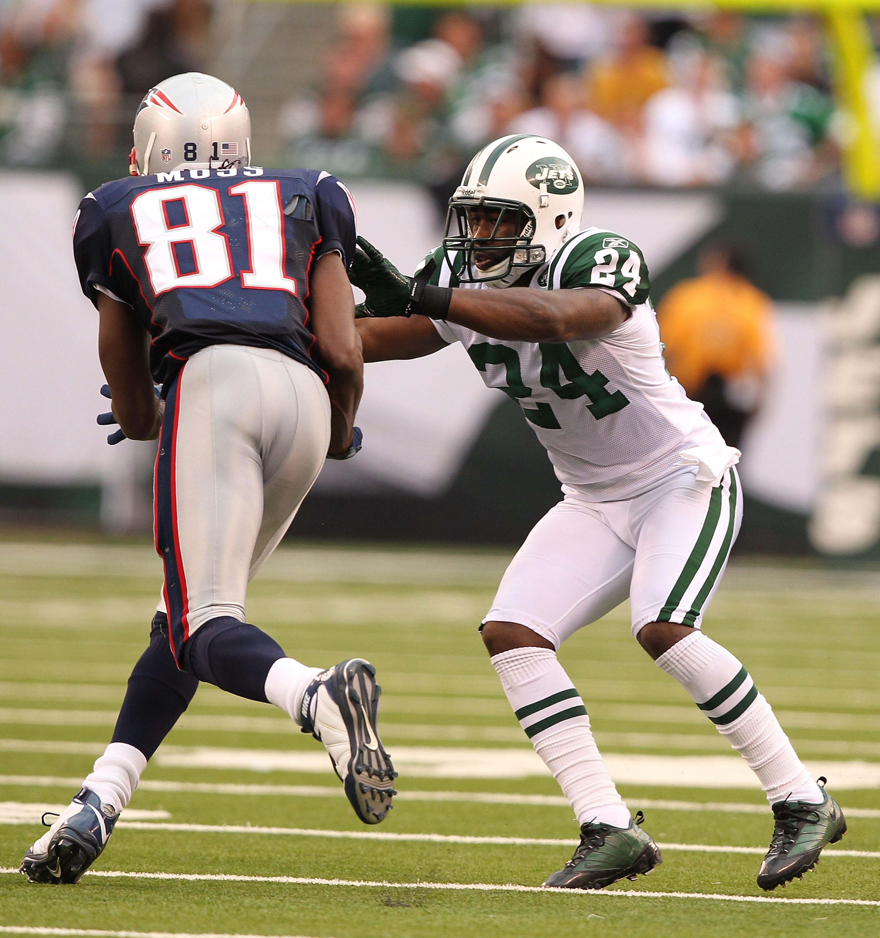 EAST RUTHERFORD, NJ - SEPTEMBER 19:  Darrelle Revis #24 of the New York Jets defends against Randy Moss #81 of the New England Patriots during their  game on September 19, 2010 at the New Meadowlands Stadium  in East Rutherford, New Jersey.  (Photo by Al 