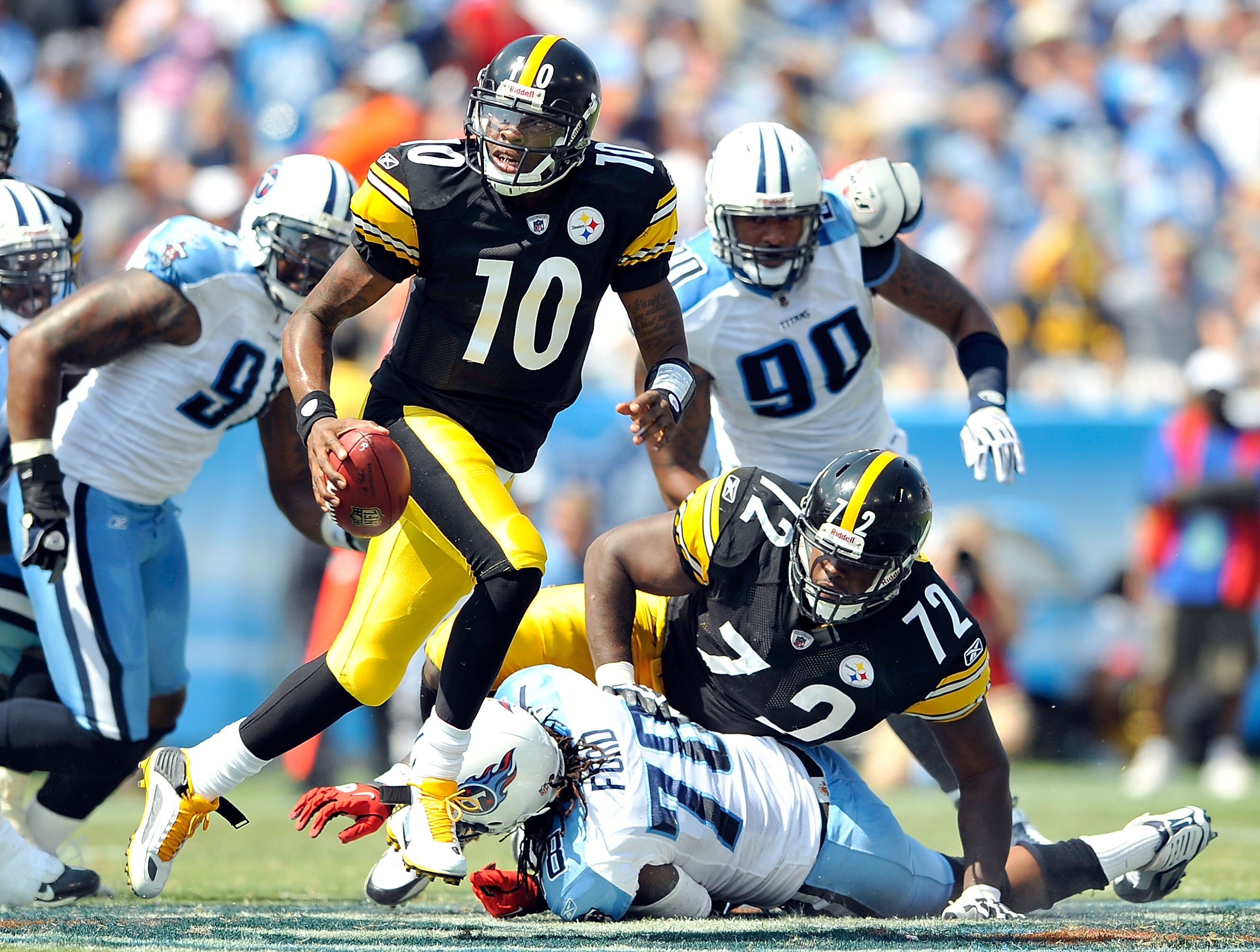 NASHVILLE, TN - SEPTEMBER 19:  Quarterback Dennis Dixon #10 of the Pittsburgh Steelers rolls out under pressure from the Tennessee Titans defense during the first half at LP Field on September 19, 2010 in Nashville, Tennessee.  (Photo by Grant Halverson/G
