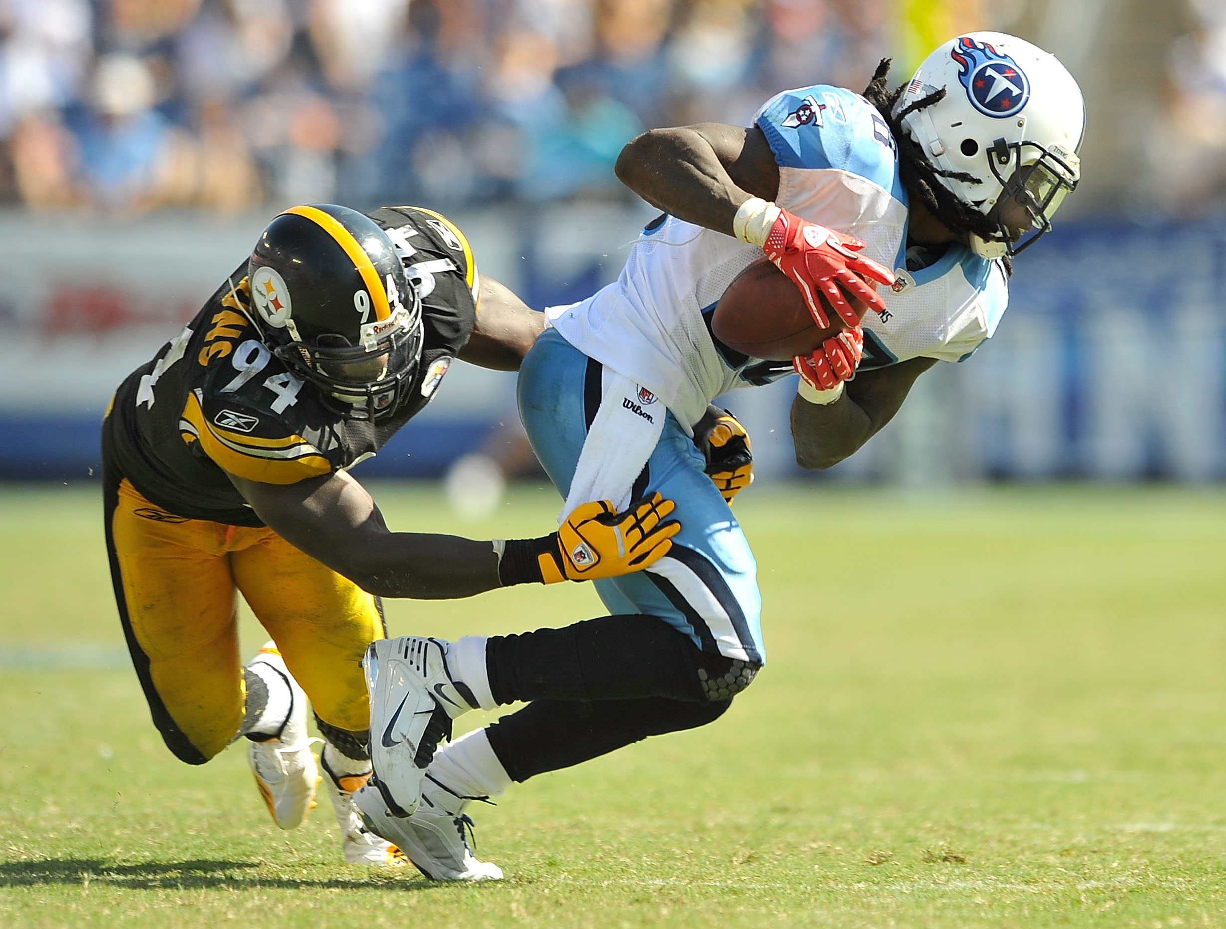 NASHVILLE, TN - SEPTEMBER 19:  Lawrence Timmons #94 of the Pittsburgh Steelers tackles Chris Johnson #28 of the Tennessee Titans at LP Field on September 19, 2010 in Nashville, Tennessee. The Steelers won 19-11.  (Photo by Grant Halverson/Getty Images)