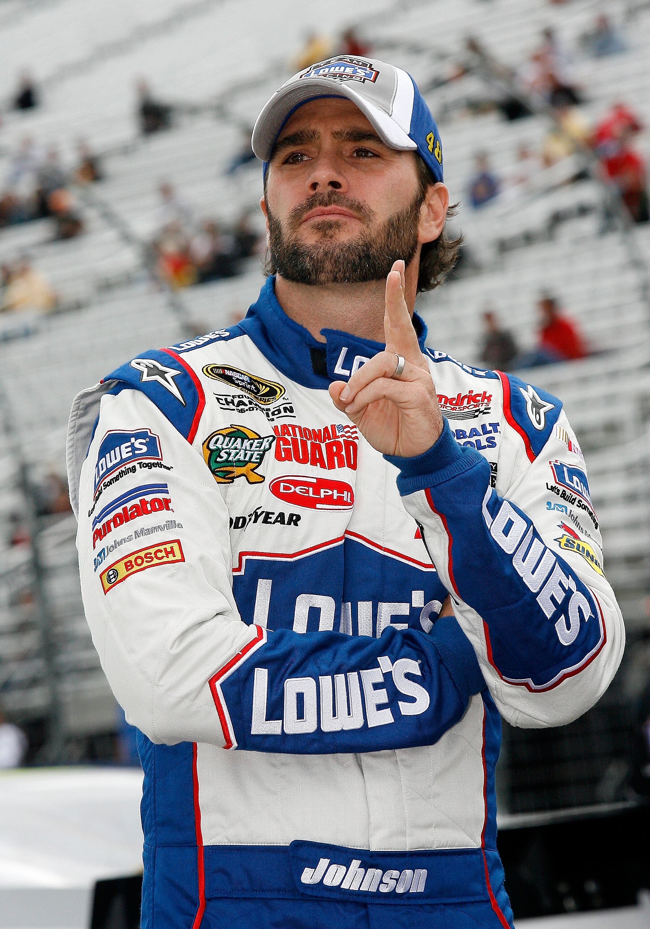 LOUDON, NH - SEPTEMBER 17:  Jimmie Johnson, driver of the #48 Lowe's/John Manville Chevrolet, looks on during qualifying for the NASCAR Sprint Cup Series Sylvania 300 at New Hampshire Motor Speedway on September 17, 2010 in Loudon, New Hampshire.  (Photo