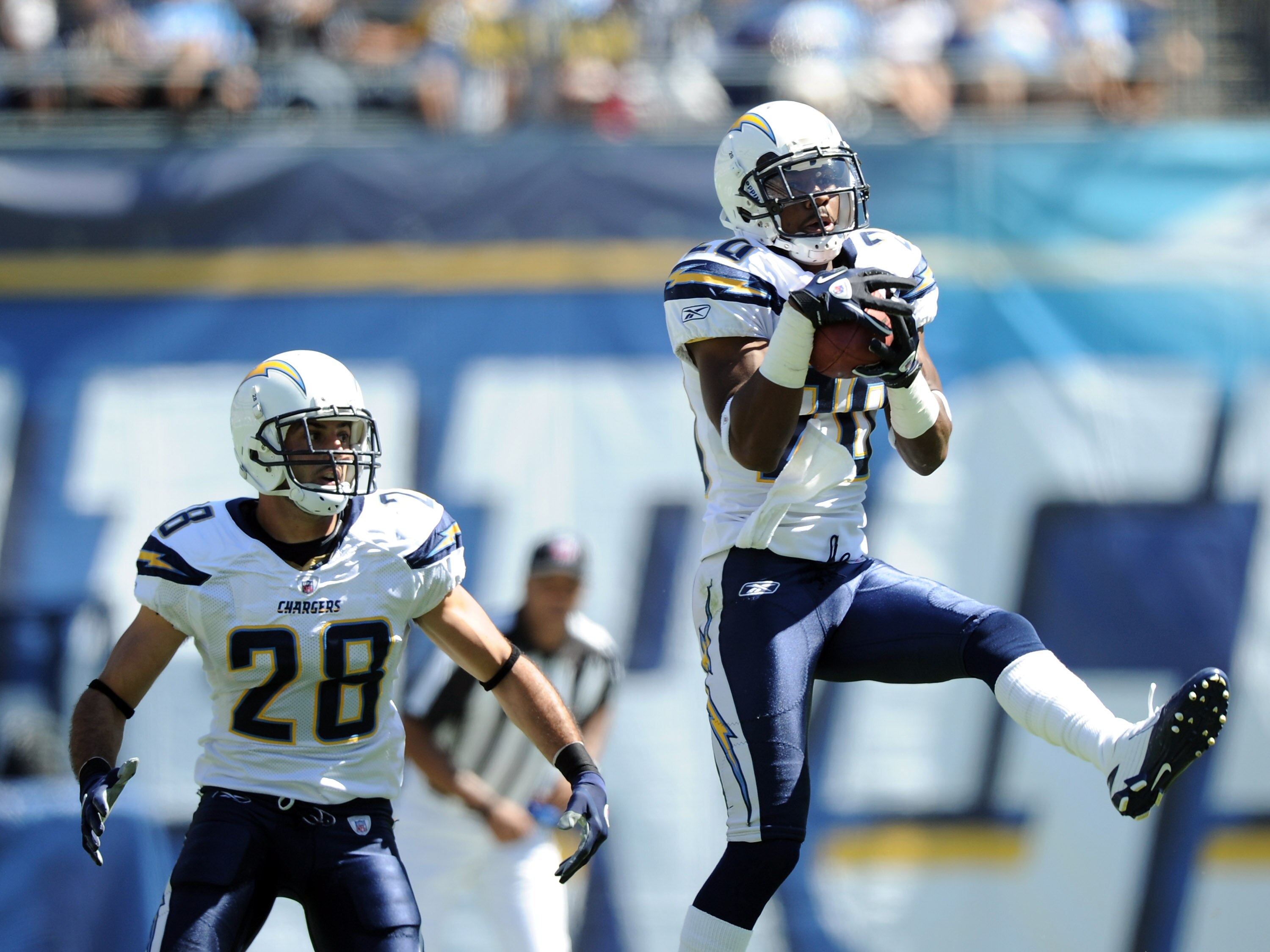 SAN DIEGO - SEPTEMBER 19:  Antoine Cason #20 of the San Diego Chargers makes an interception in front of Steve Gregory #28 against the Jacksonville Jaguars during the second quarter at Qualcomm Stadium on September 19, 2010 in San Diego, California.  (Pho