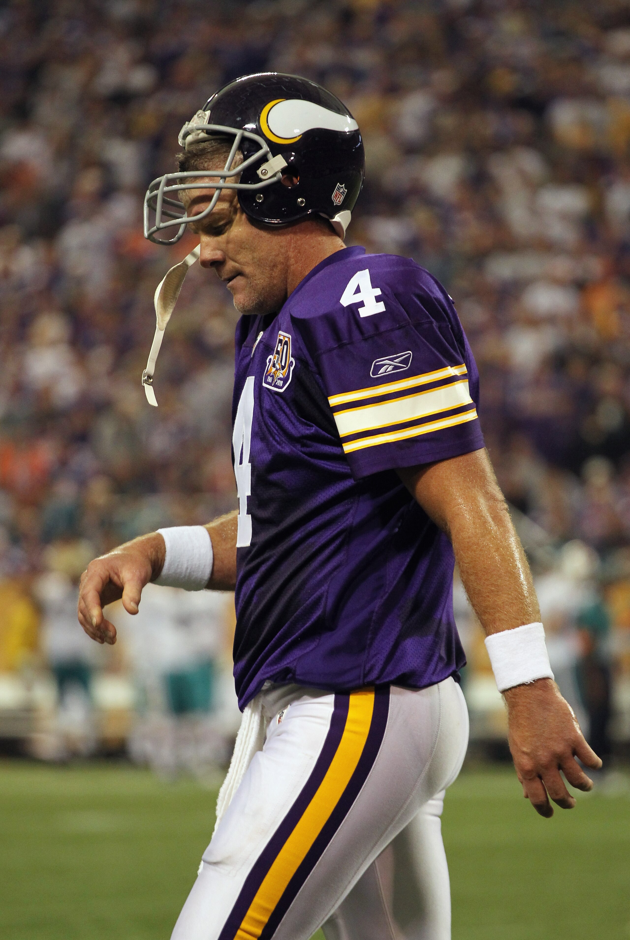 MINNEAPOLIS - SEPTEMBER 19:  Quarterback Brett Favre #4 of the Minnesota Vikings walks off the field after failing to make a first down during the second half of the game against the Miami Dolphins on September 19, 2010 at Hubert H. Humphrey Metrodome in