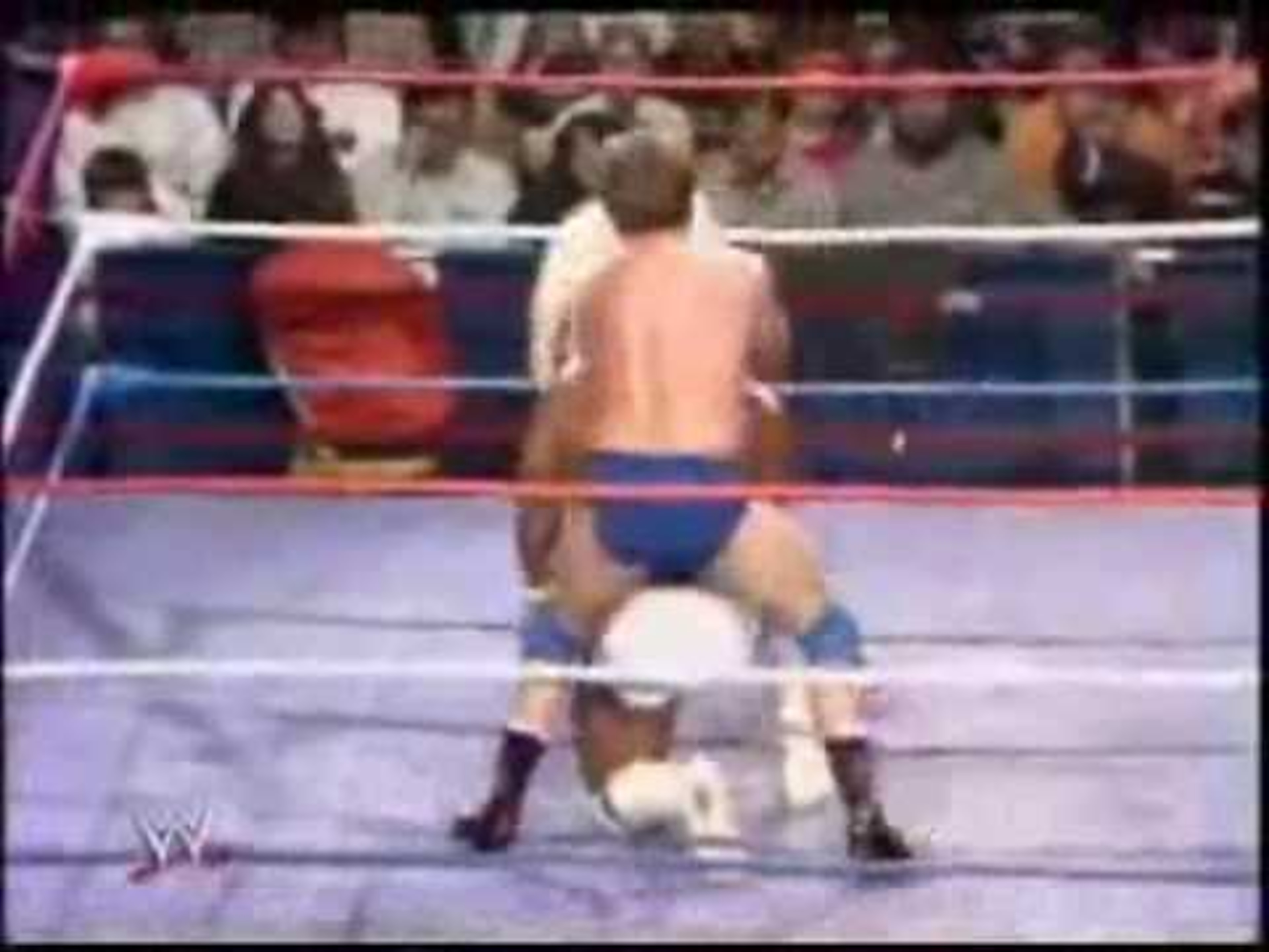 That is Roddy Piper doing his signature sleeper hold in the 80s