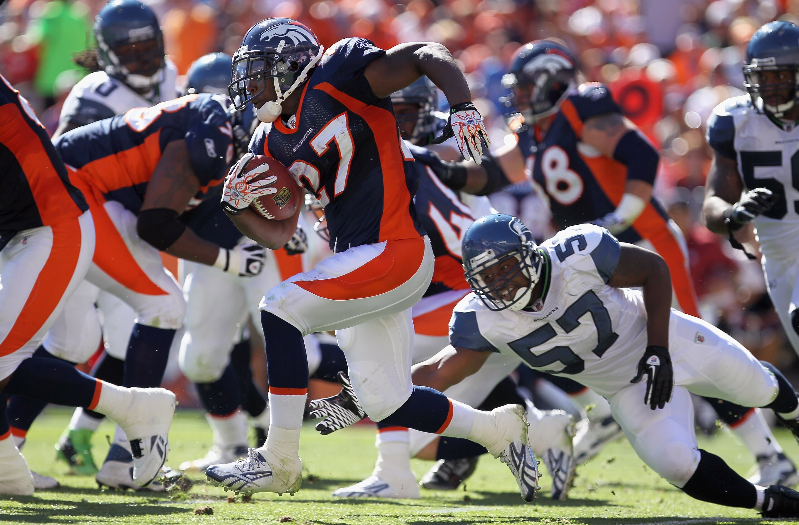 DENVER - SEPTEMBER 19: Running back Knowshon Moreno #27 of the Denver Broncos picks up yardage as he eludes linebacker David Hawthorne #57 of the Seattle Seahawks at INVESCO Field at Mile High on September 19, 2010 in Denver, Colorado. (Photo by Doug Pe DENVER - SEPTEMBER 19: Running back Knowshon Moreno #27 of the Denver Broncos picks up yardage as he eludes linebacker David Hawthorne #57 of the Seattle Seahawks at INVESCO Field at Mile High on September 19, 2010 in Denver, Colorado. (Photo by Doug Pe