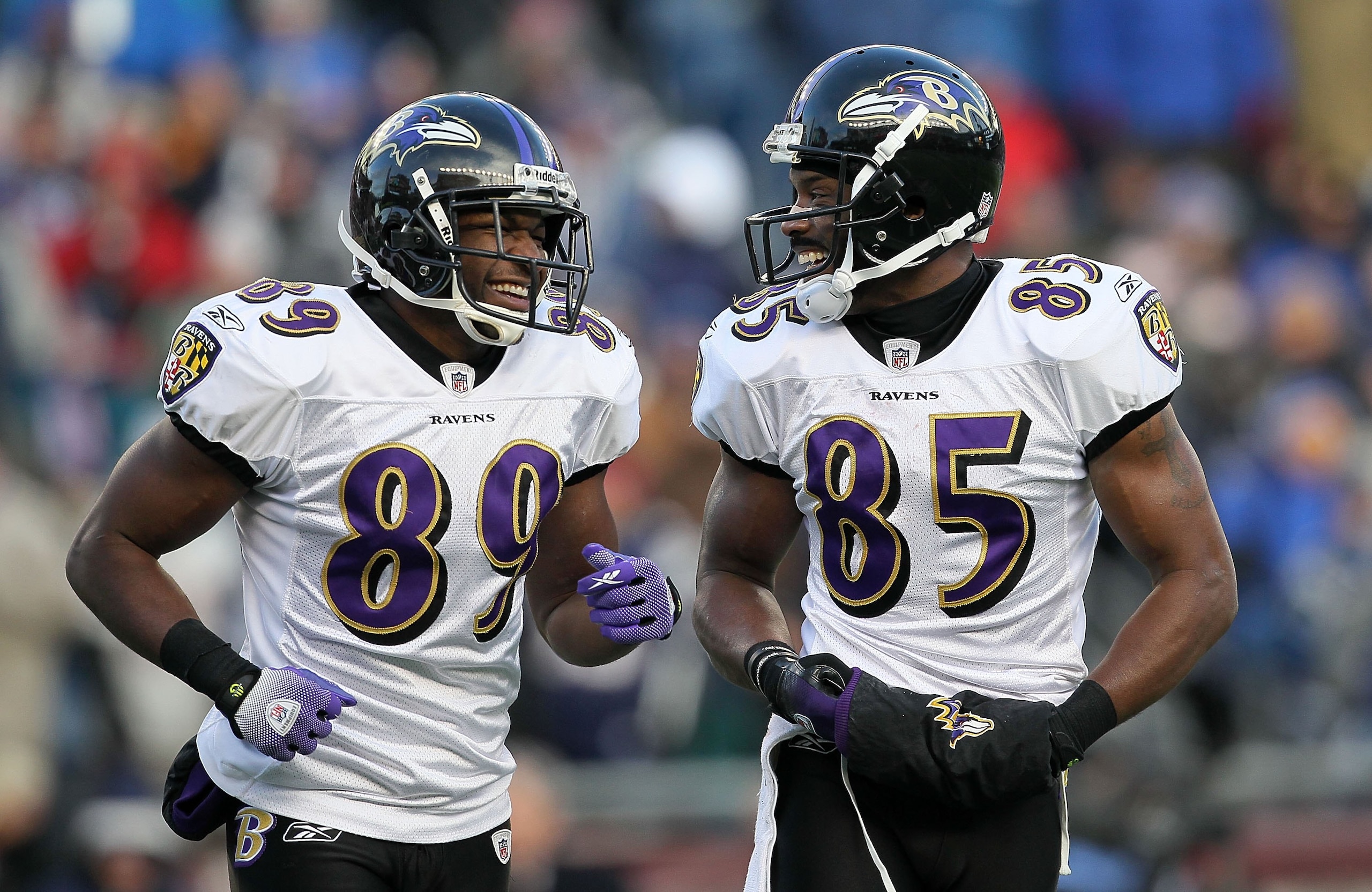 FOXBORO, MA - JANUARY 10:  (L-R) Mark Clayton #89 and Derrick Mason #85 of the Baltimore Ravens talk on the field against the New England Patriots during the 2010 AFC wild-card playoff game at Gillette Stadium on January 10, 2010 in Foxboro, Massachusetts
