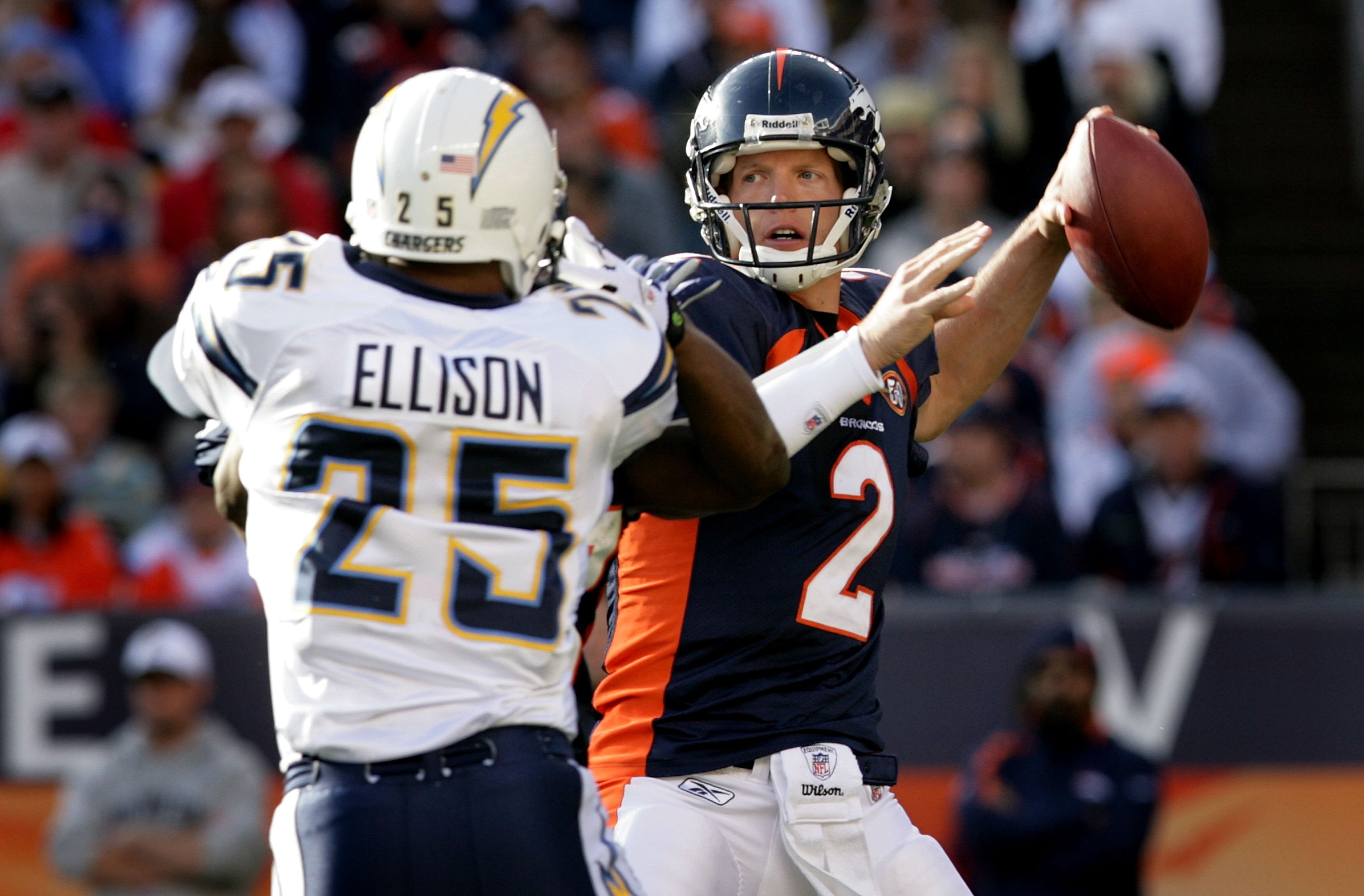 DENVER - NOVEMBER 22:  Quarterback Chris Simms #2 of the Denver Broncos looks to deliver a pass against Kevin Ellison #25 of the San Diego Chargers during NFL action at Invesco Field at Mile High on November 22, 2009 in Denver, Colorado. The Chargers defe