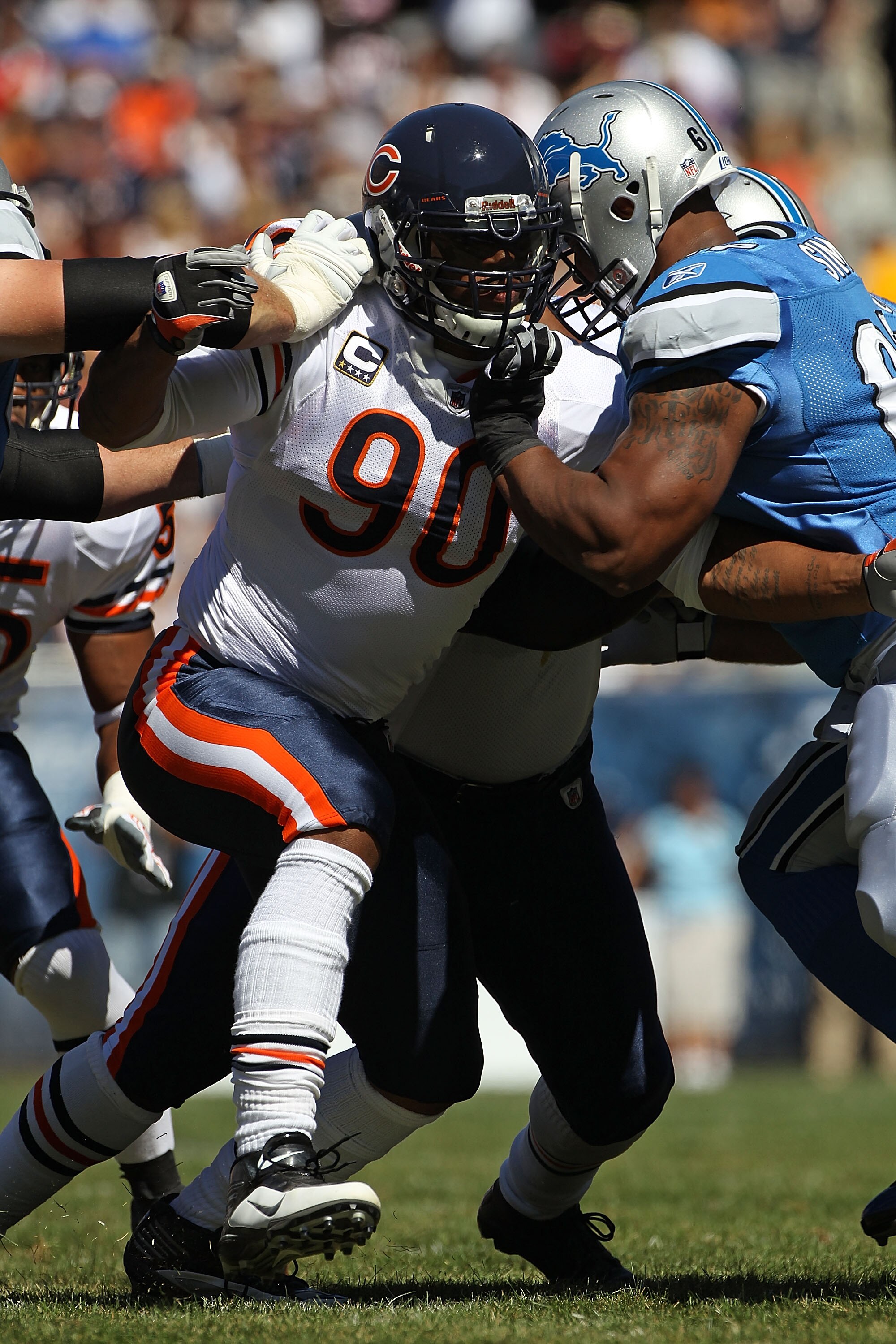 CHICAGO - SEPTEMBER 12: Julius Peppers #90 of the Chicago Bears rushes against Rob Sims #67 of the Detroit Lions during the NFL season opening game at Soldier Field on September 12, 2010 in Chicago, Illinois. The Bears defeated the Lions 19-14. (Photo by