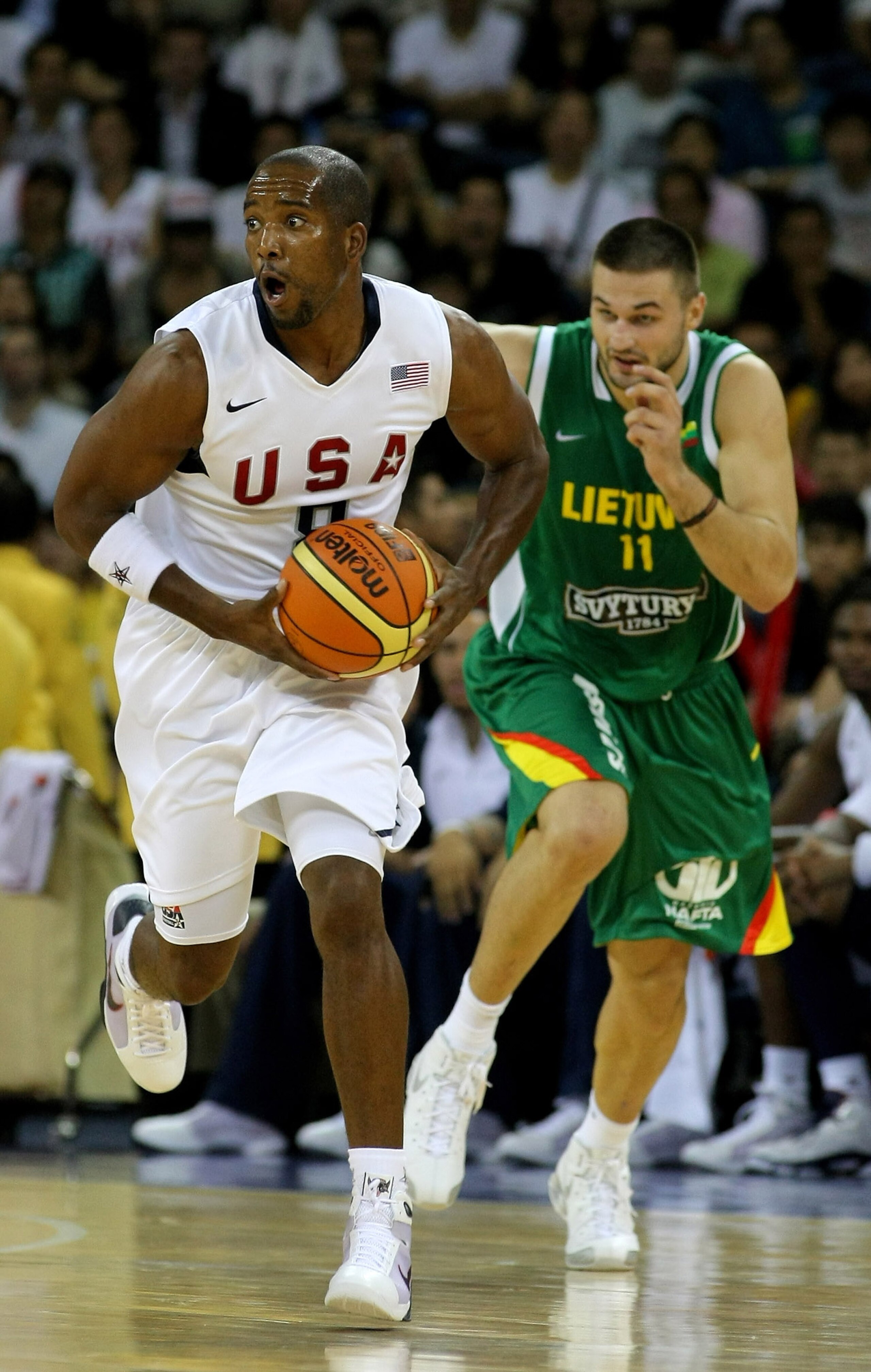 MACAU, CHINA - AUGUST 01:  Michael Redd #8 of the USA Basketball mens senior national team runs away from Linas Kleiza #11 of Lithuania during the USA Basketball International challenge between USA and Lithuania at The Venetian Hotel, on August 1, 2008  i