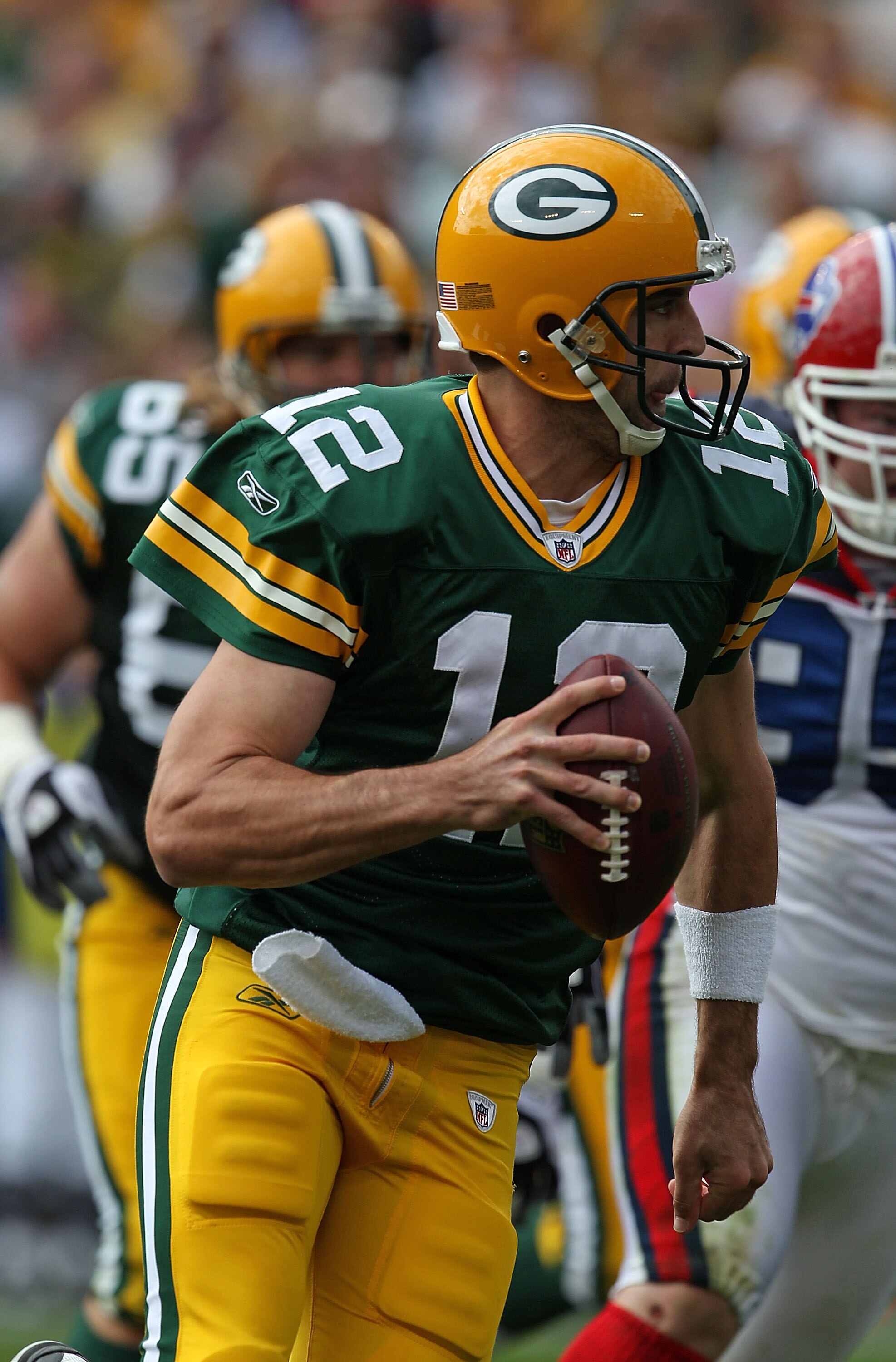 GREEN BAY, WI - SEPTEMBER 19: Aaron Rodgers #12 of the Green Bay Packers runs for a touchdown against the Buffalo Bills at Lambeau Field on September 19, 2010 in Green Bay, Wisconsin. The Packers defeated the Bills 34-7. (Photo by Jonathan Daniel/Getty Im