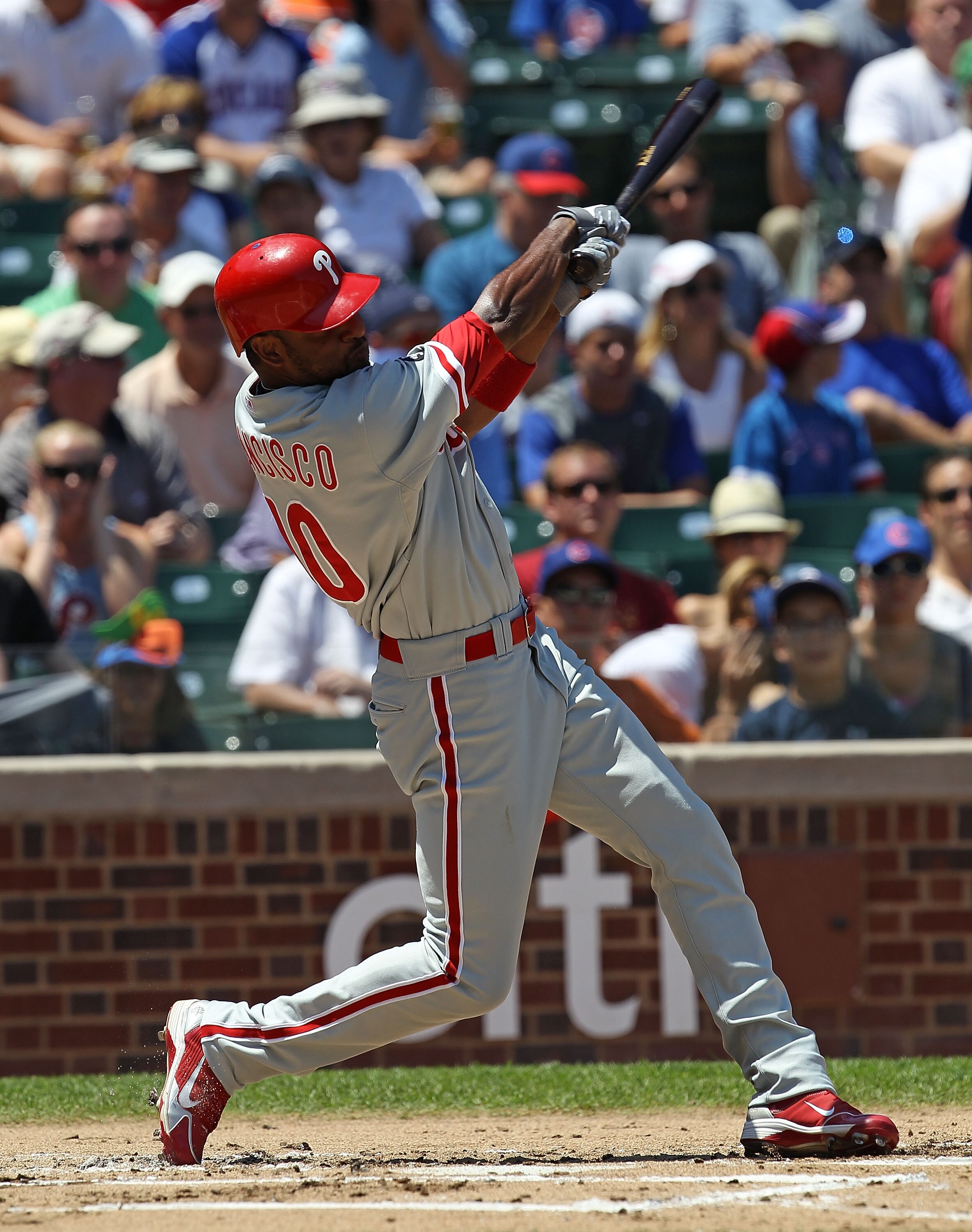 CHICAGO - JULY 16: Ben Francisco #10 of the Philadelphia Phillies hits the ball against the Chicago Cubs at Wrigley Field on July 16, 2010 in Chicago, Illinois. The Cubs defeated the Phillies 4-3. (Photo by Jonathan Daniel/Getty Images)