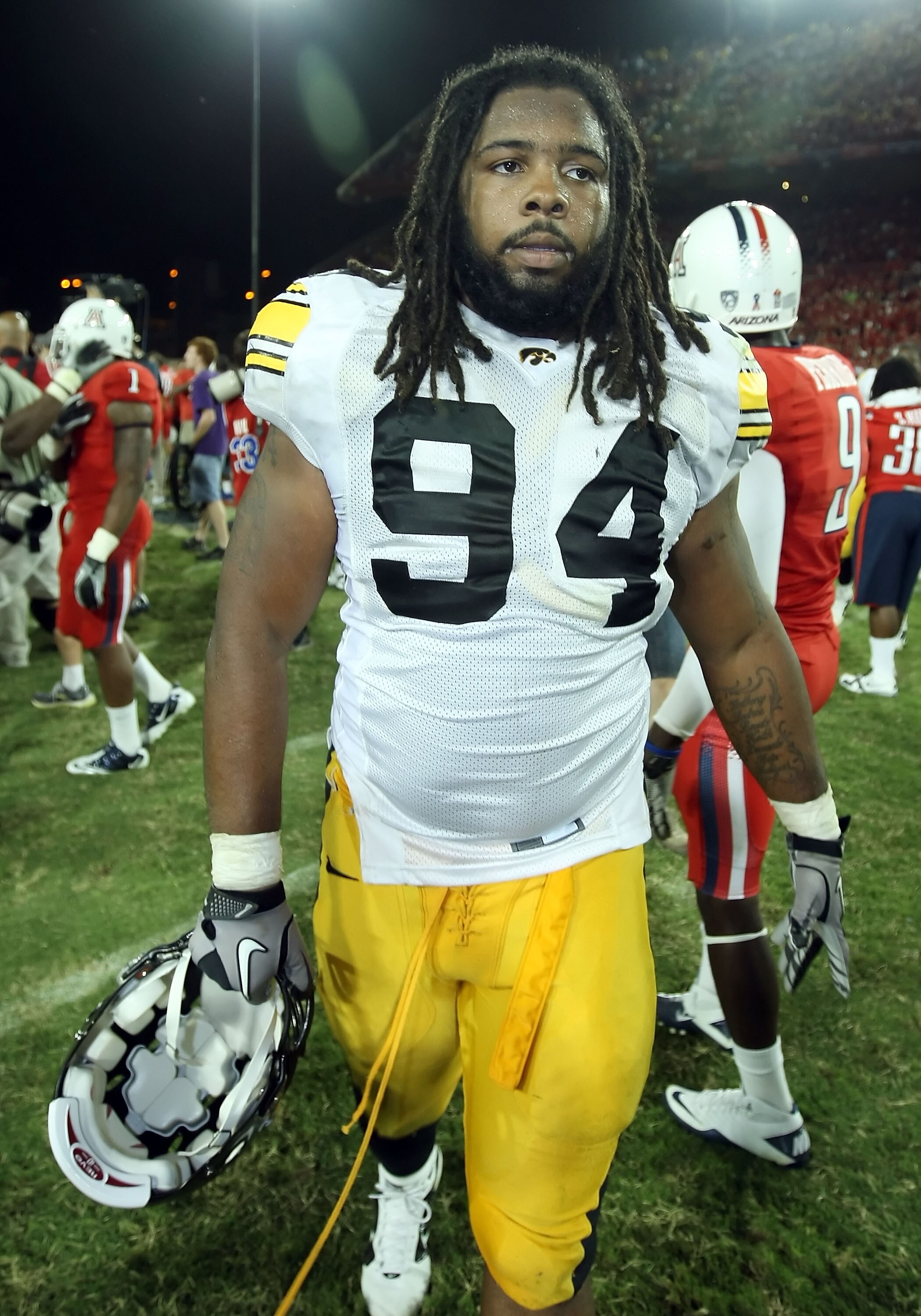 TUCSON, AZ - SEPTEMBER 18:  Defensive end Adrian Clayborn #94 of the Iowa Hawkeyes walks off the field after being defeated by the Arizona Wildcats in the college football game at Arizona Stadium on September 18, 2010 in Tucson, Arizona. The Wildcats defe