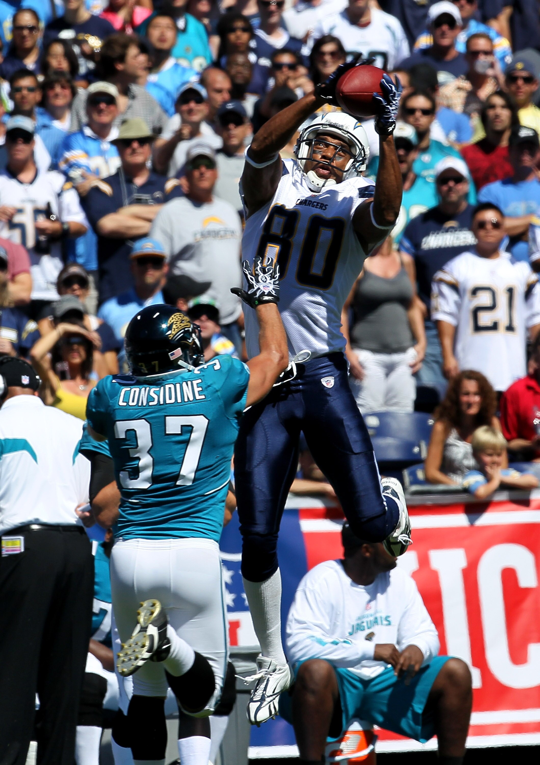 SAN DIEGO - SEPTEMBER 19:  Wide receiver Malcom Floyd #80 of the San Diego Chargers jumps to catch a pass over safety Sean Considine #37 of the Jacksonville Jaguars at Qualcomm Stadium on September 19, 2010 in San Diego, California. The Chargers won 38-13