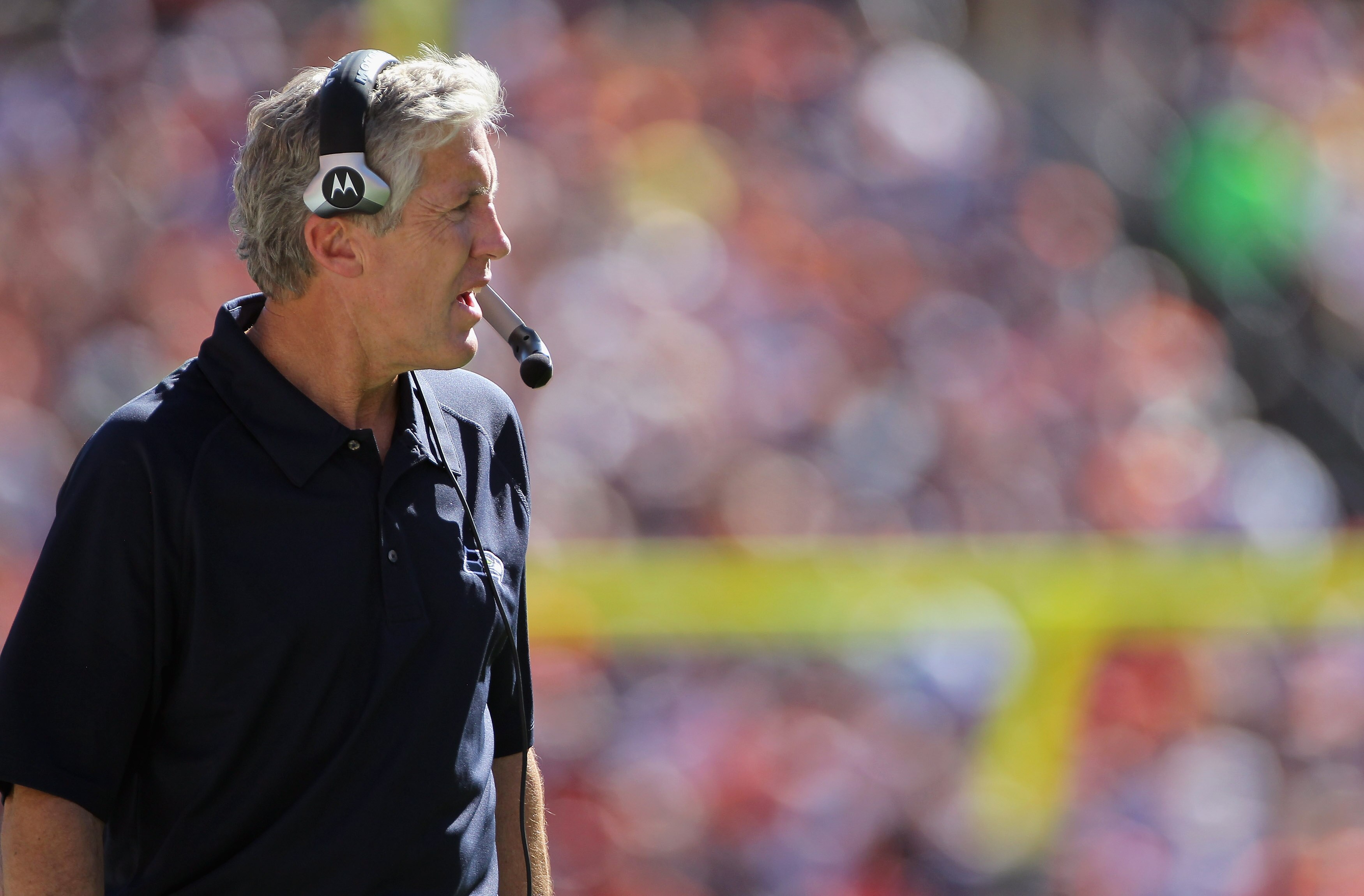 DENVER - SEPTEMBER 19:  Head coach Pete Carroll of the Seattle Seahawks directs his team against the Denver Broncos at INVESCO Field at Mile High on September 19, 2010 in Denver, Colorado. The Broncos defeated the Seahawks 31-14.  (Photo by Doug Pensinger
