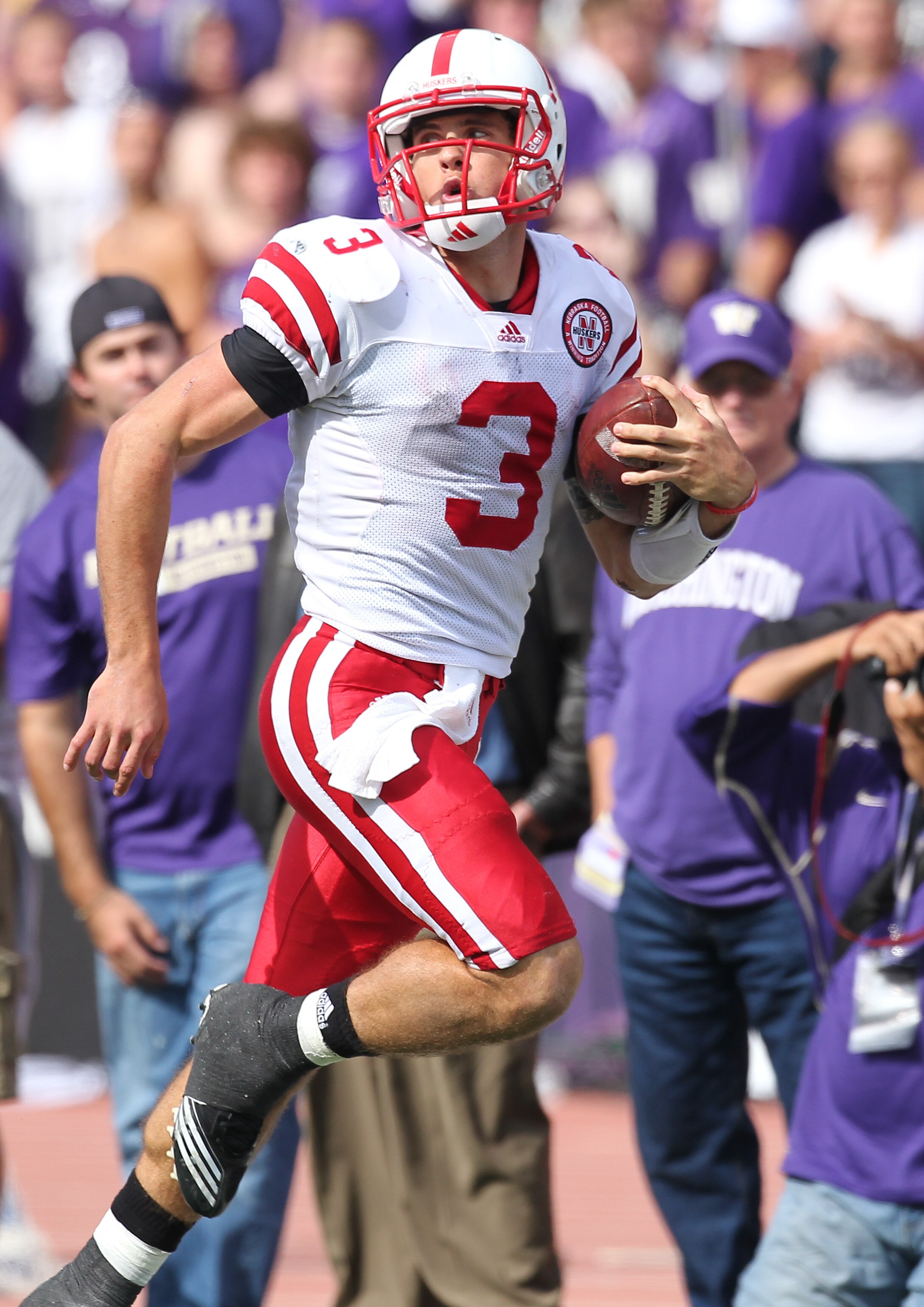 SEATTLE - SEPTEMBER 18: Quarterback Taylor Martinez #3 of the Nebraska Cornhuskers rushes for an 80 yard touchdown run in the third quarter against the Washington Huskies on September 18, 2010 at Husky Stadium in Seattle, Washington. The Cornhuskers defea