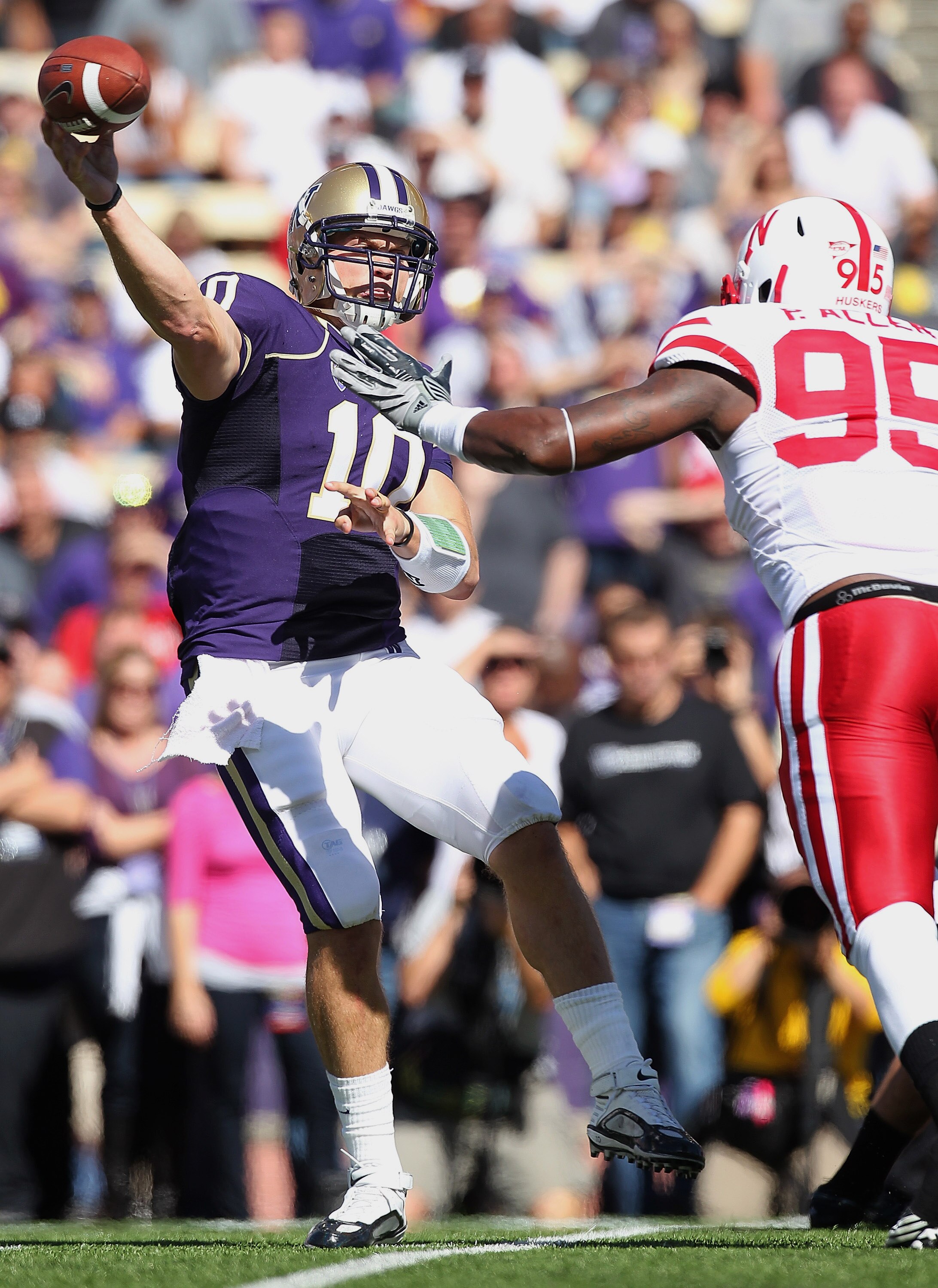 SEATTLE - SEPTEMBER 18:  Quarterback Jake Locker #10 of the Washington Huskies passes against defensive end Pierre Allen #95 of the Nebraska Cornhuskers on September 18, 2010 at Husky Stadium in Seattle, Washington. (Photo by Otto Greule Jr/Getty Images)