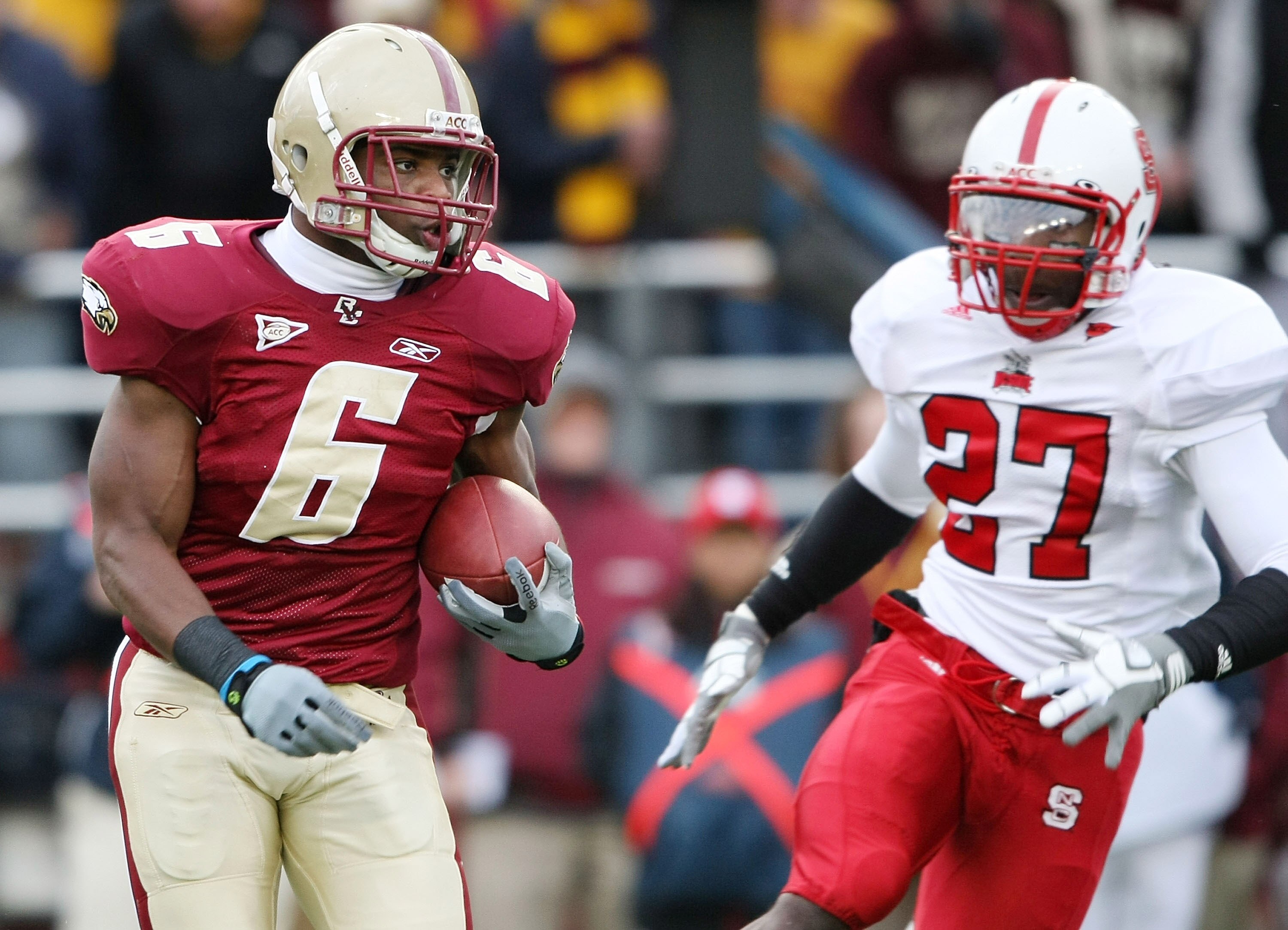 CHESTNUT HILL, MA - OCTOBER 17:  Jeff Smith #6 of the Boston College Eagles carries the ball as Earl Wolff #27 of the North Carolina State Wolf Pack defends on October 17, 2009 at Alumni Stadium in Chestnut Hill, Massachusetts.  (Photo by Elsa/Getty Image