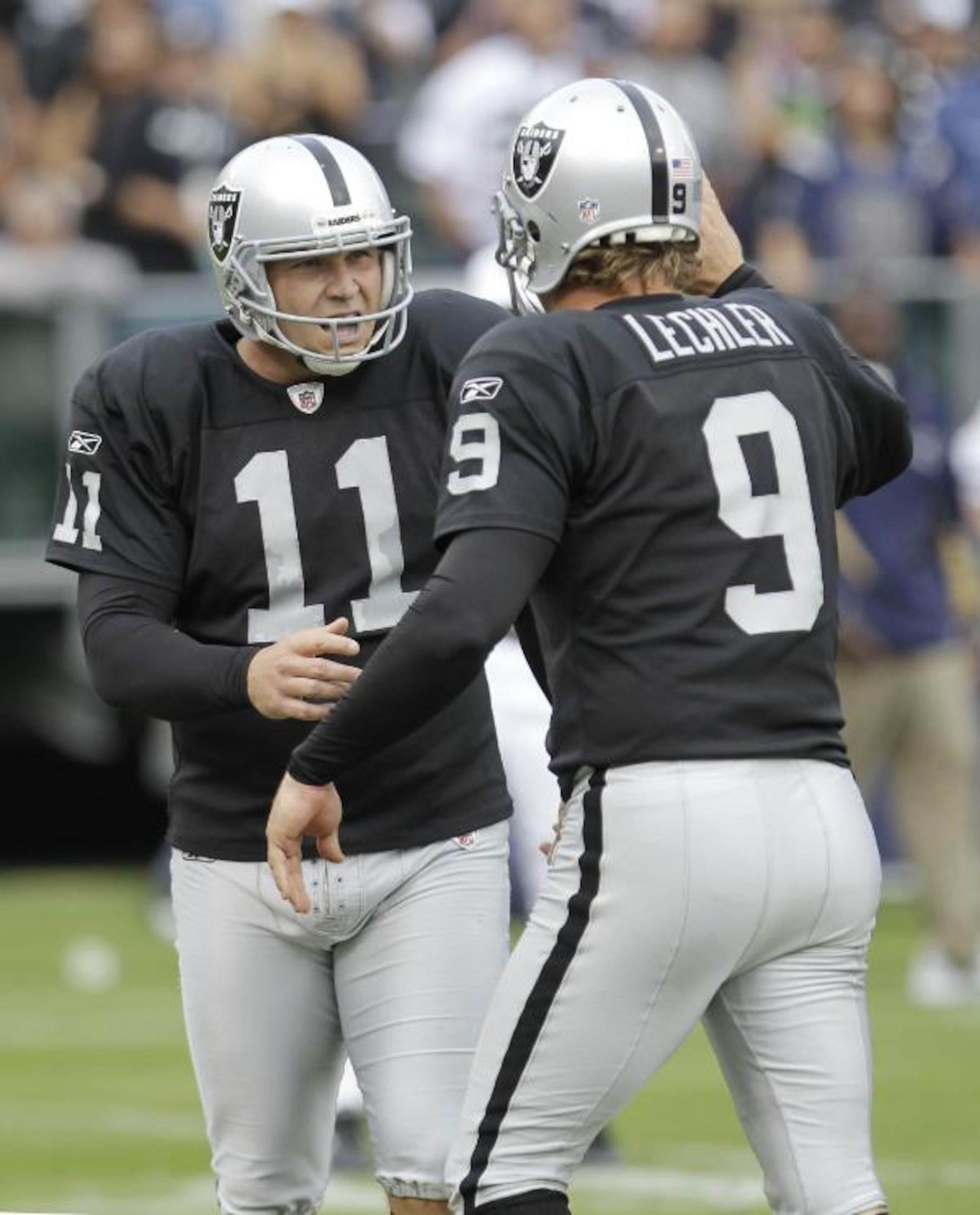 Janikowski and Lechler celebrate what proved to be the game winning kick.