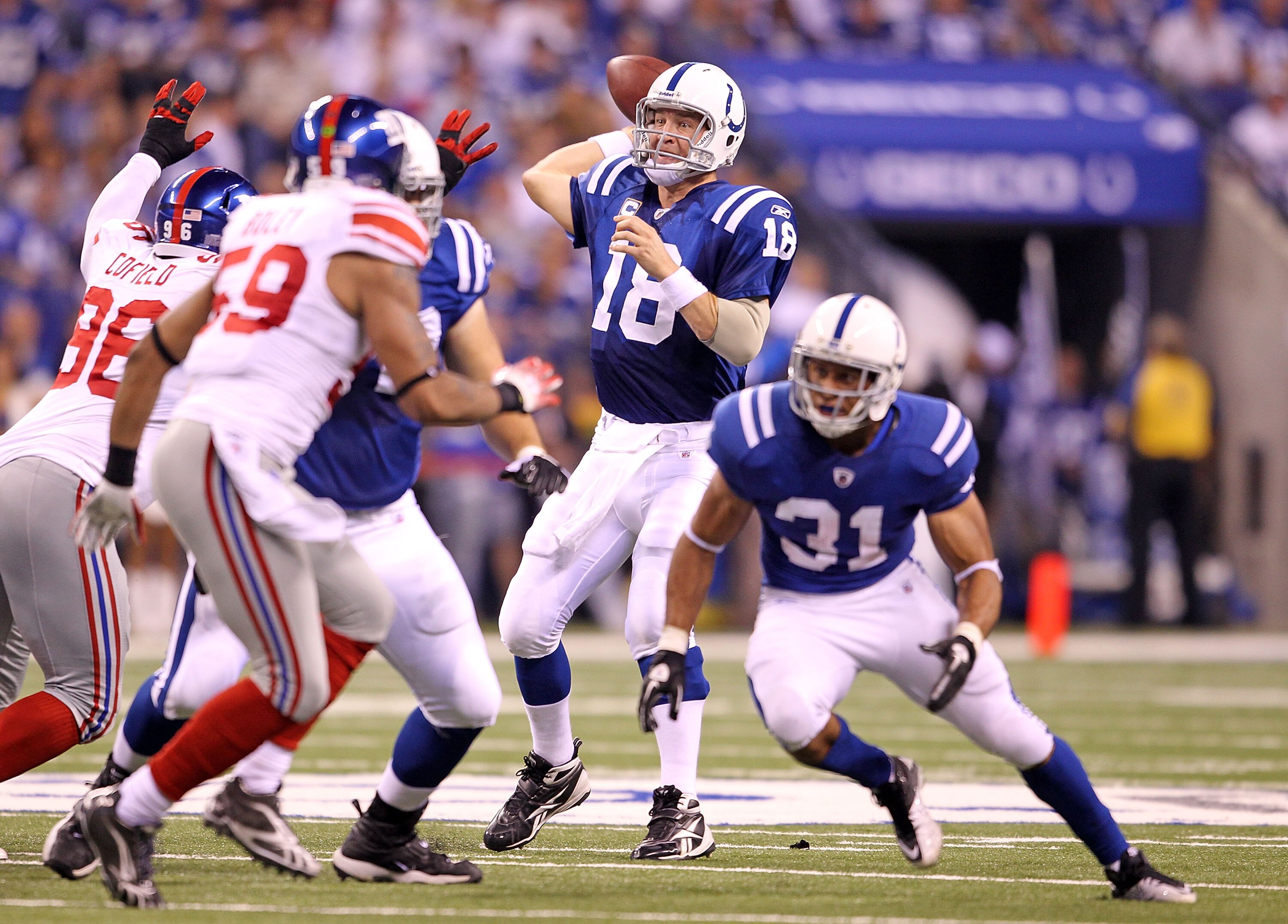 INDIANAPOLIS - SEPTEMBER 19:  Peyton Manning #18 of the Indianapolis Colts throws a pass during  the NFL game against the New York Giants  at Lucas Oil Stadium on September 19, 2010 in Indianapolis, Indiana.  (Photo by Andy Lyons/Getty Images)
