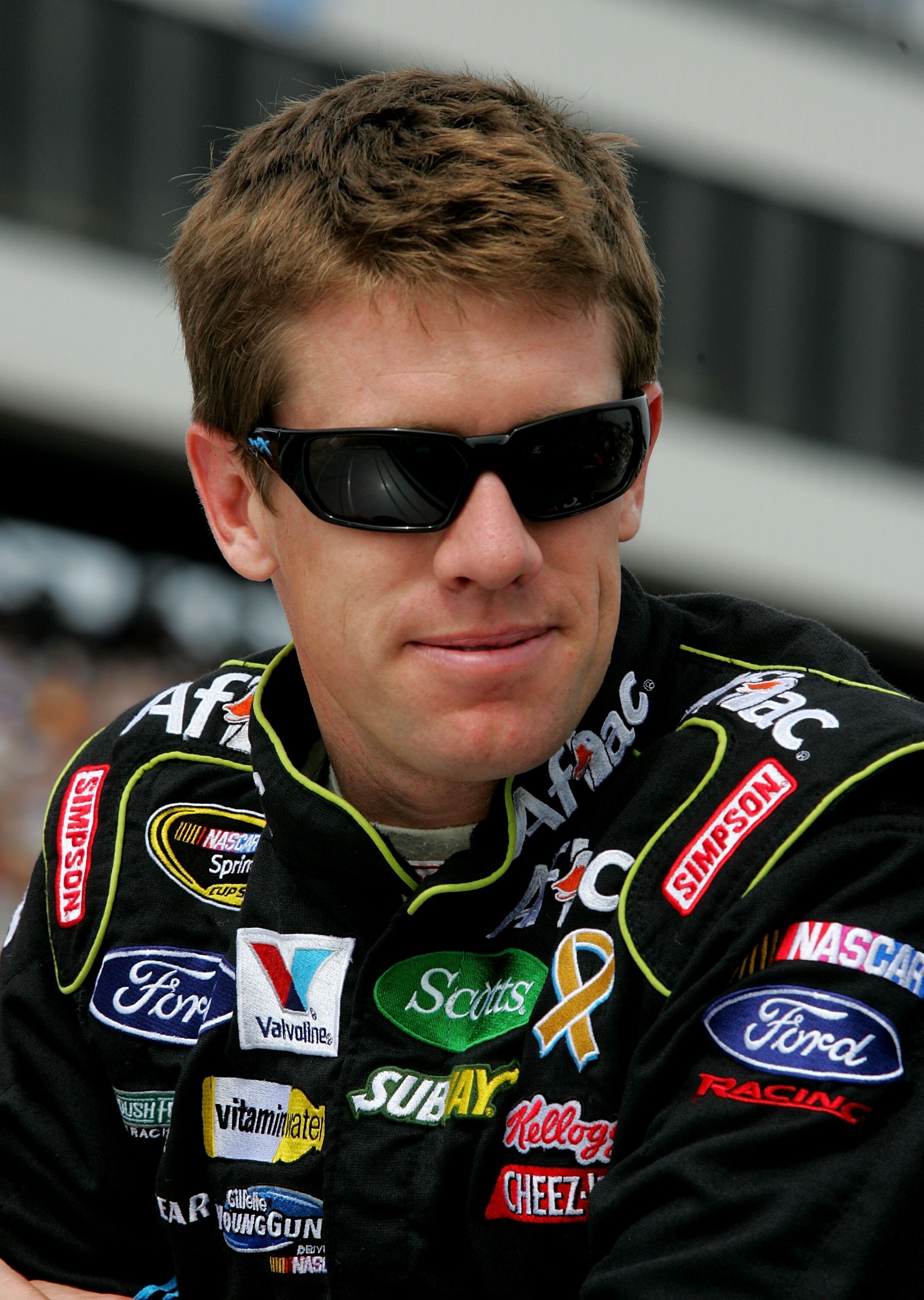 LOUDON, NH - SEPTEMBER 19:  Carl Edwards, driver of the #99 Aflac Ford, stands on the grid during the NASCAR Sprint Cup Series Sylvania 300 at New Hampshire Motor Speedway on September 19, 2010 in Loudon, New Hampshire.  (Photo by Jerry Markland/Getty Ima