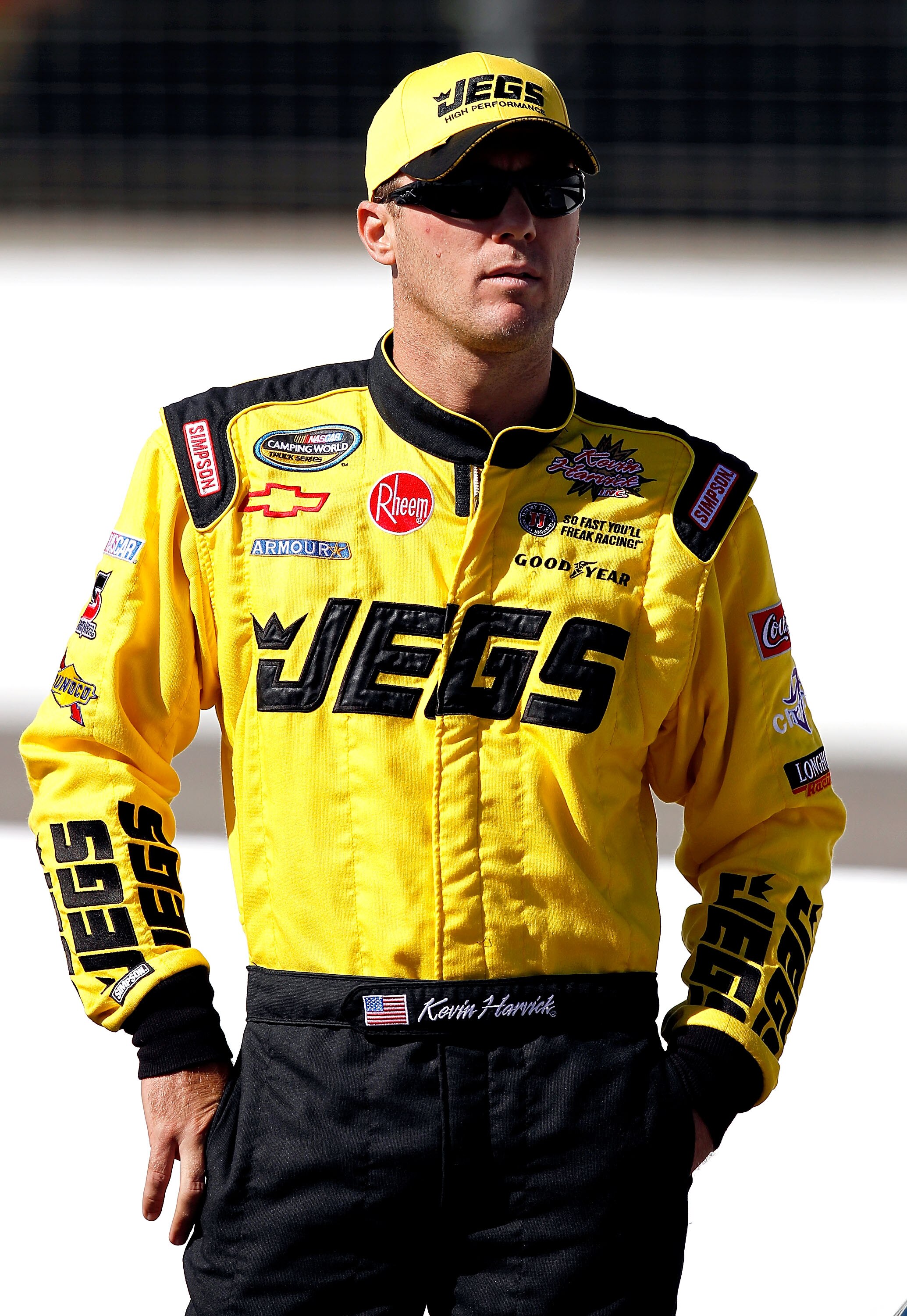 LOUDON, NH - SEPTEMBER 18:  Kevin Harvick, driver of the JEGS.com Chevrolet walks along the grid  during qualifying for the NASCAR Camping World Truck Series TheRaceDayRaffleSeries.com 175 at the New Hampshire Motor Speedway on September 18, 2010 in Loudo