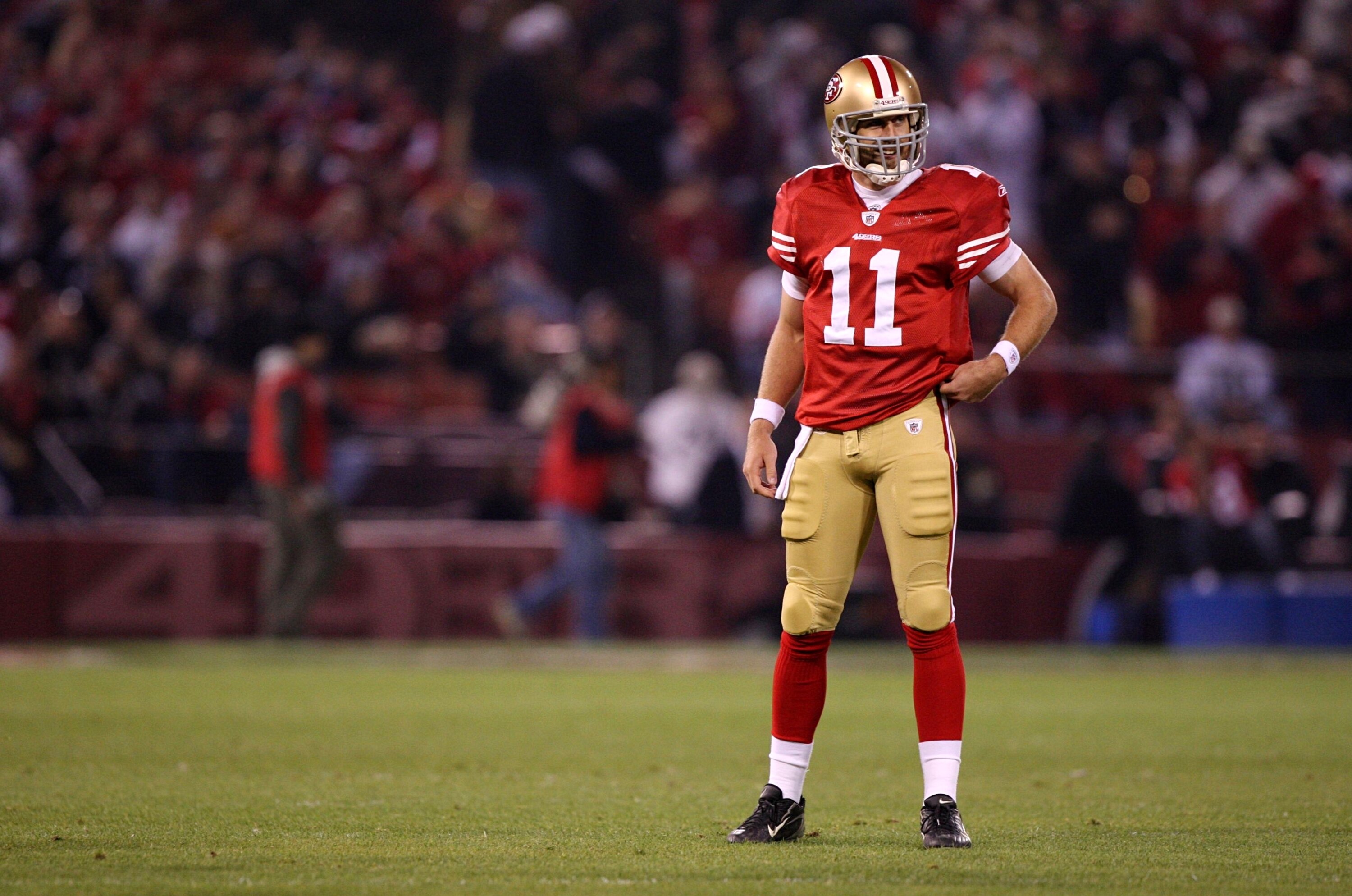SAN FRANCISCO - DECEMBER 14:  Quarterback Alex Smith #11 of the San Francisco 49ers looks on against the Arizona Cardinals in the first quarter at Candlestick Park on December 14, 2009 in San Francisco, California. (Photo by Jed Jacobsohn/Getty Images)