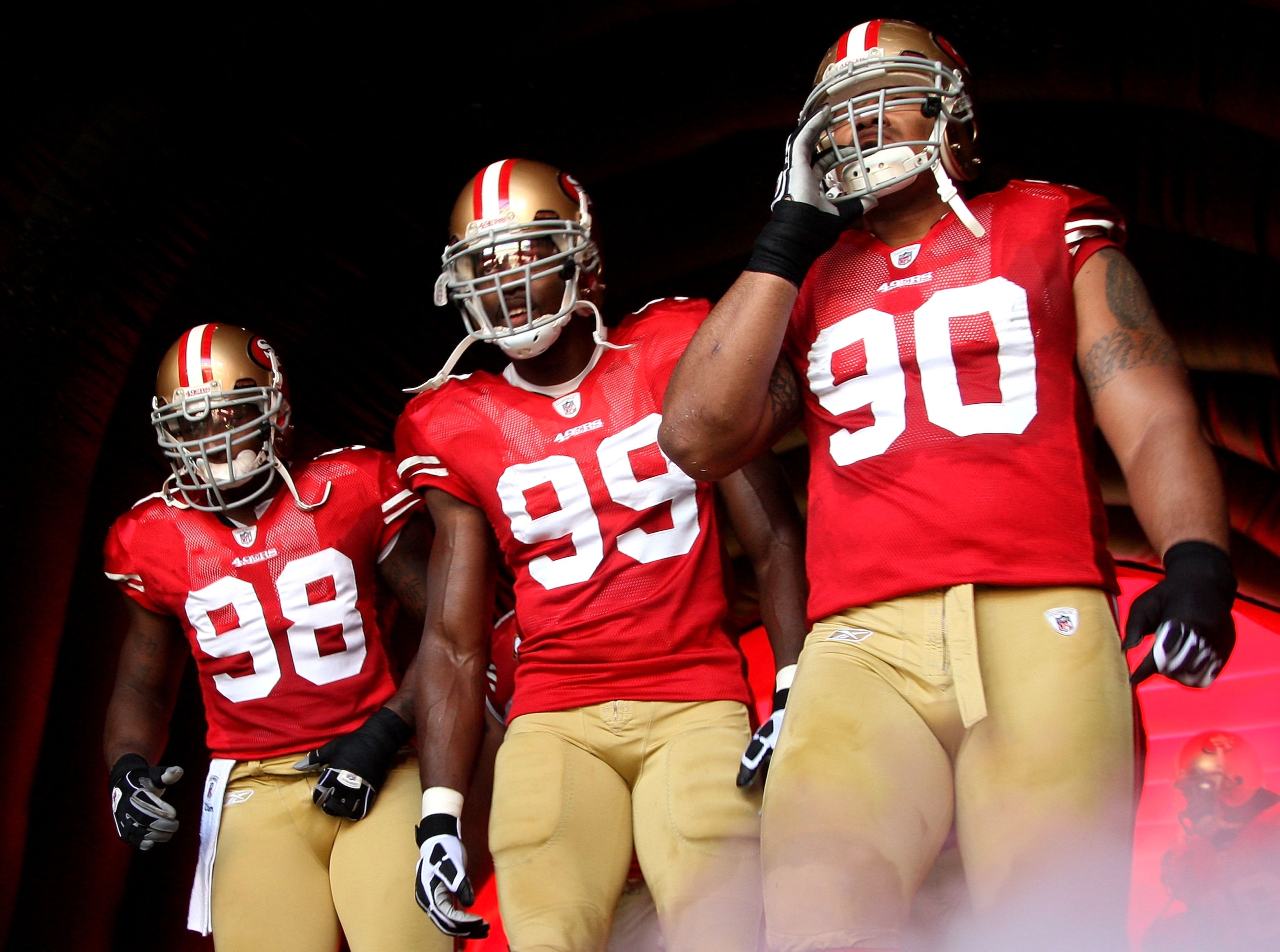 SAN FRANCISCO - NOVEMBER 08: Parys Haralson #98, Manny Lawson #99 and Isaac Sopoaga #90 of the San Francisco 49ers wait to be introduced in NFL action against the Tennessee Titans on November 8, 2009 at Candlestick Park in San Francisco, California.  (Pho