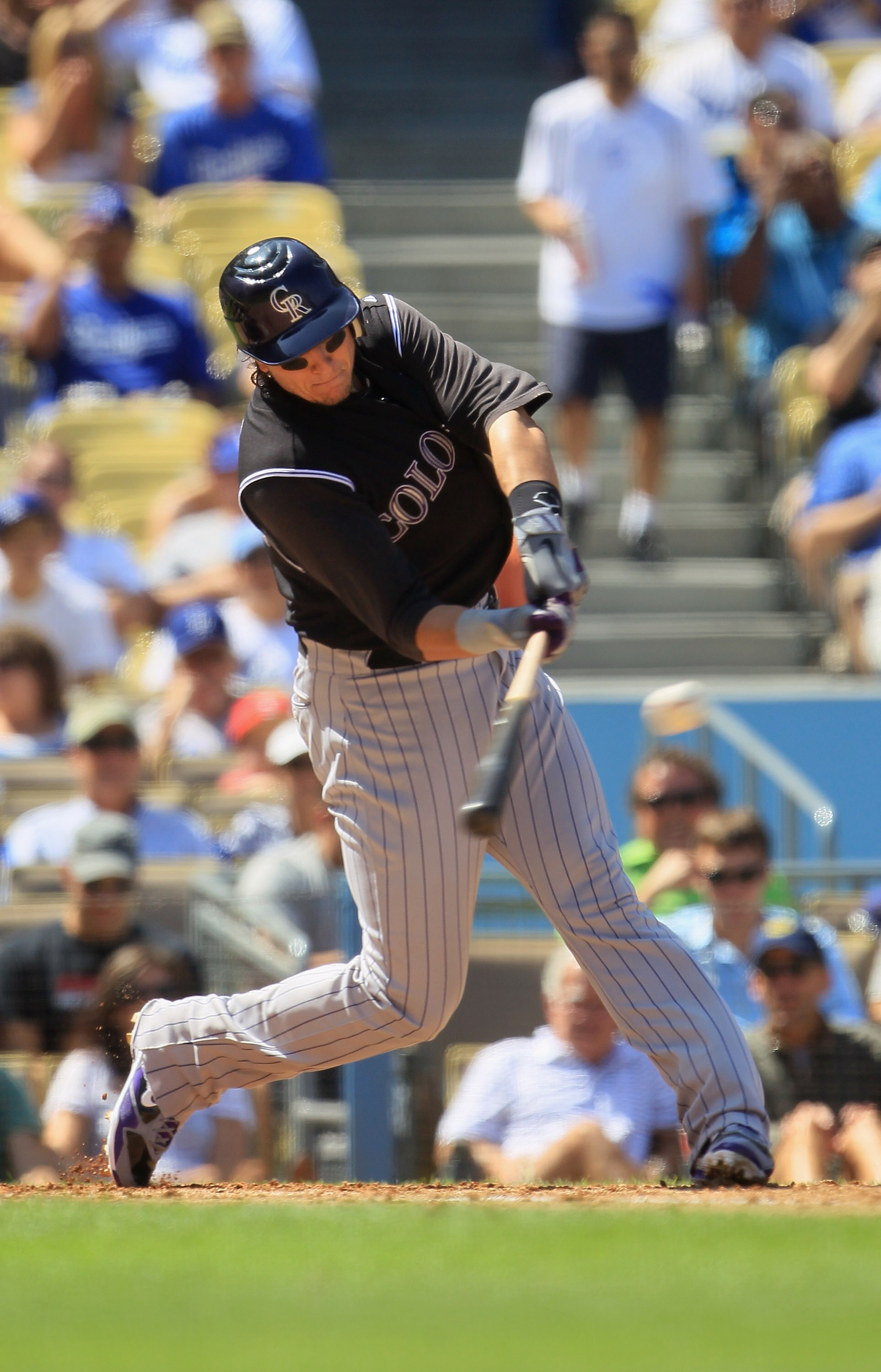 LOS ANGELES, CA - SEPTEMBER 18: Troy Tulowitzki #2 of the Colorado Rockies hits a double against the Los Angeles Dodgers in the third inning at Dodger Stadium on September 18, 2010 in Los Angeles, California. The Rockies defeated the Dodgers 12-2. (Phot LOS ANGELES, CA - SEPTEMBER 18: Troy Tulowitzki #2 of the Colorado Rockies hits a double against the Los Angeles Dodgers in the third inning at Dodger Stadium on September 18, 2010 in Los Angeles, California. The Rockies defeated the Dodgers 12-2. (Phot