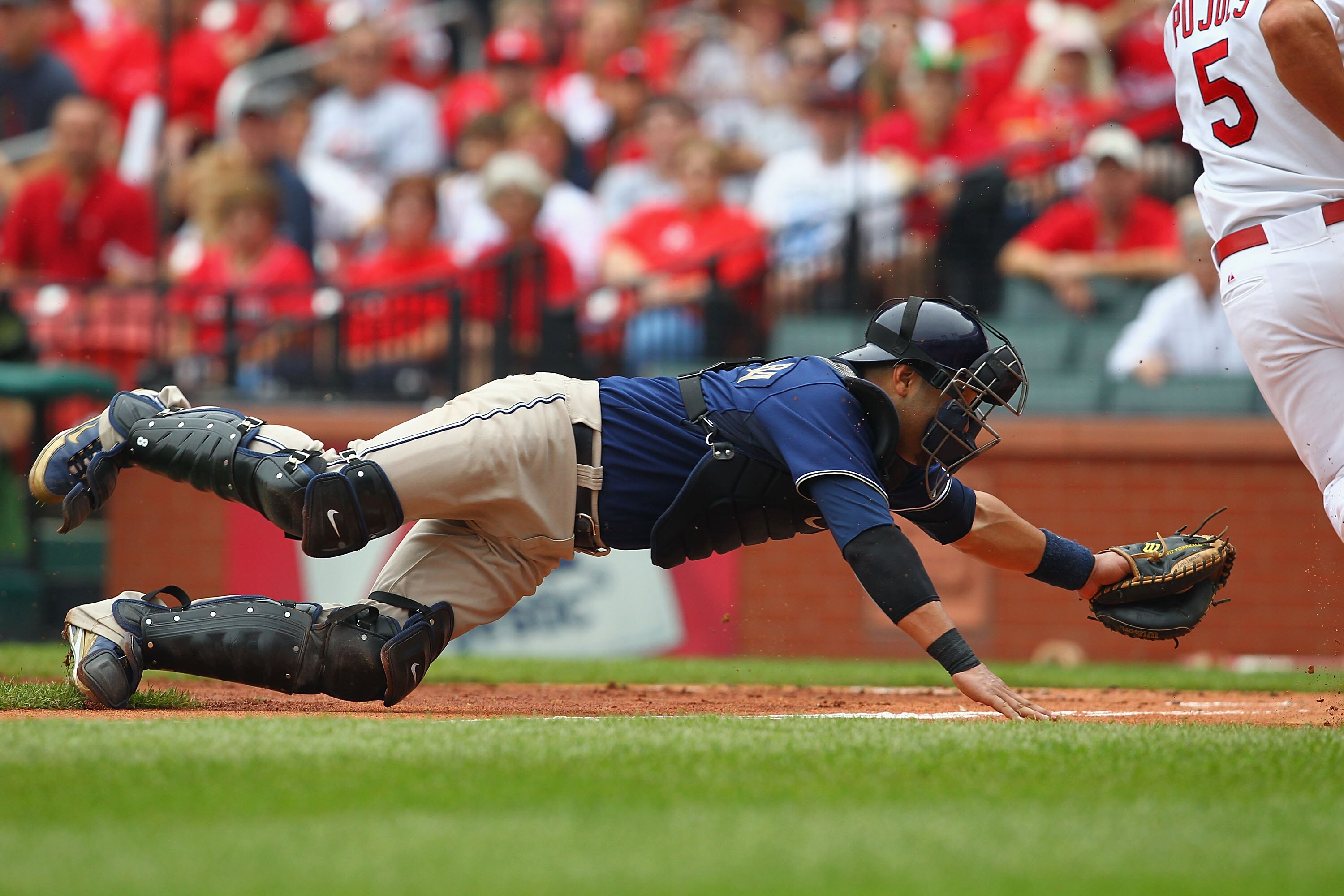 ST. LOUIS - SEPTEMBER 19: Yorvit Torrealba #8 of the San Diego Padres attempts to tag out Albert Pujols #5 of the St. Louis Cardinals at Busch Stadium on September 19, 2010 in St. Louis, Missouri. The Cardinals beat the Padres 4-1. (Photo by Dilip Vishw ST. LOUIS - SEPTEMBER 19: Yorvit Torrealba #8 of the San Diego Padres attempts to tag out Albert Pujols #5 of the St. Louis Cardinals at Busch Stadium on September 19, 2010 in St. Louis, Missouri. The Cardinals beat the Padres 4-1. (Photo by Dilip Vishw