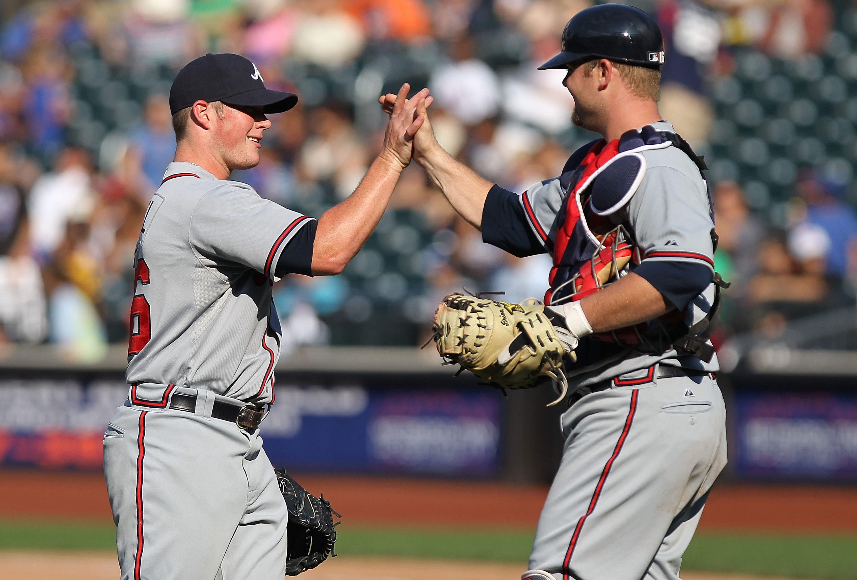 NEW YORK - SEPTEMBER 19: Craig Krimbel #46 of the Atlanta Braves celebrates the win with teammate Brian McCann #16 against the New York Mets at Citi Field on September 19, 2010 in the Flushing neighborhood of the Queens borough of New York City. (Photo b NEW YORK - SEPTEMBER 19: Craig Krimbel #46 of the Atlanta Braves celebrates the win with teammate Brian McCann #16 against the New York Mets at Citi Field on September 19, 2010 in the Flushing neighborhood of the Queens borough of New York City. (Photo b