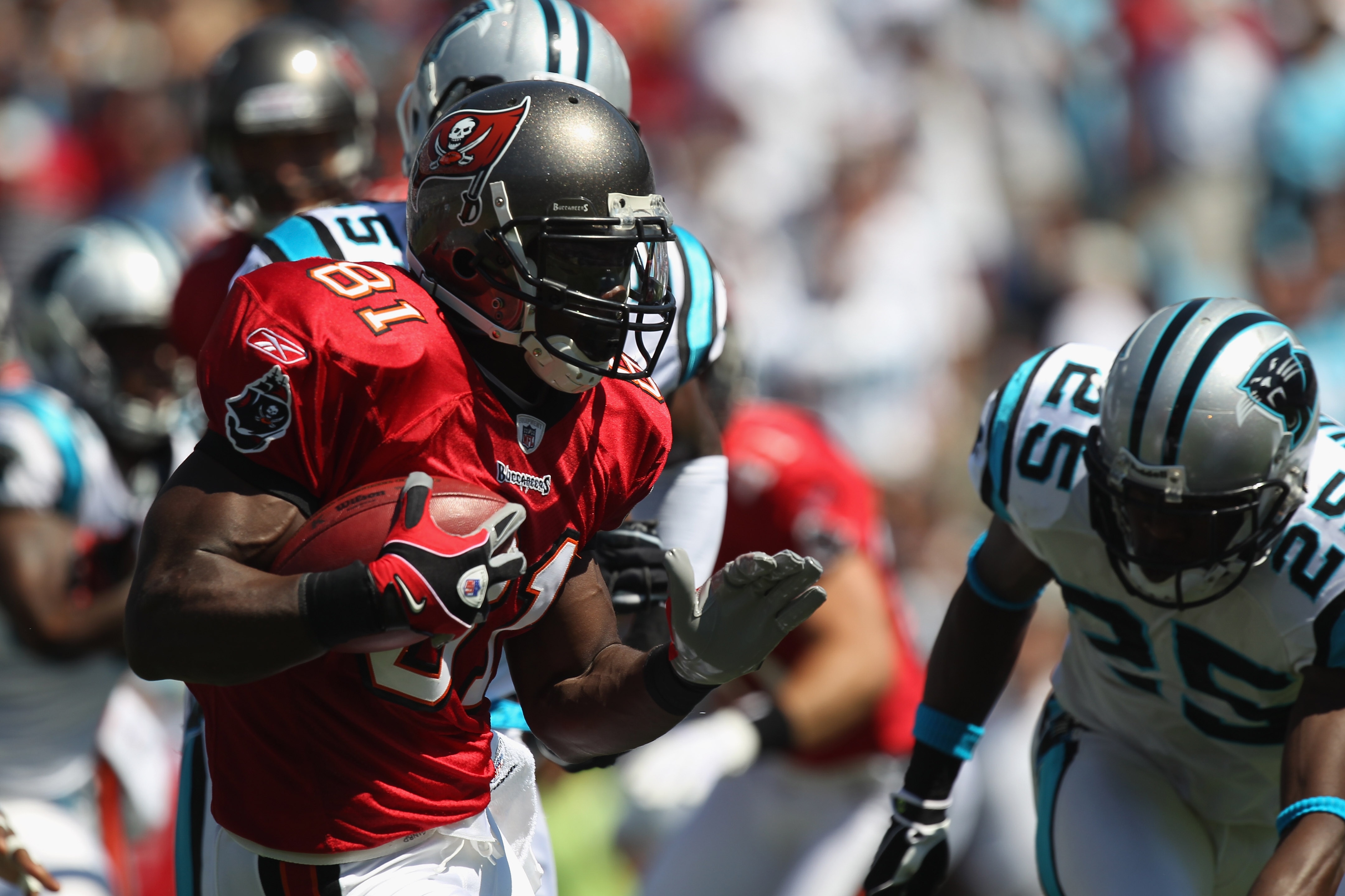 CHARLOTTE, NC - SEPTEMBER 19:  Michael Spurlock #81 of the Tampa Bay Buccaneers runs with the ball against the defense of the Carolina Panthers during their game at Bank of America Stadium on September 19, 2010 in Charlotte, North Carolina.  (Photo by Str