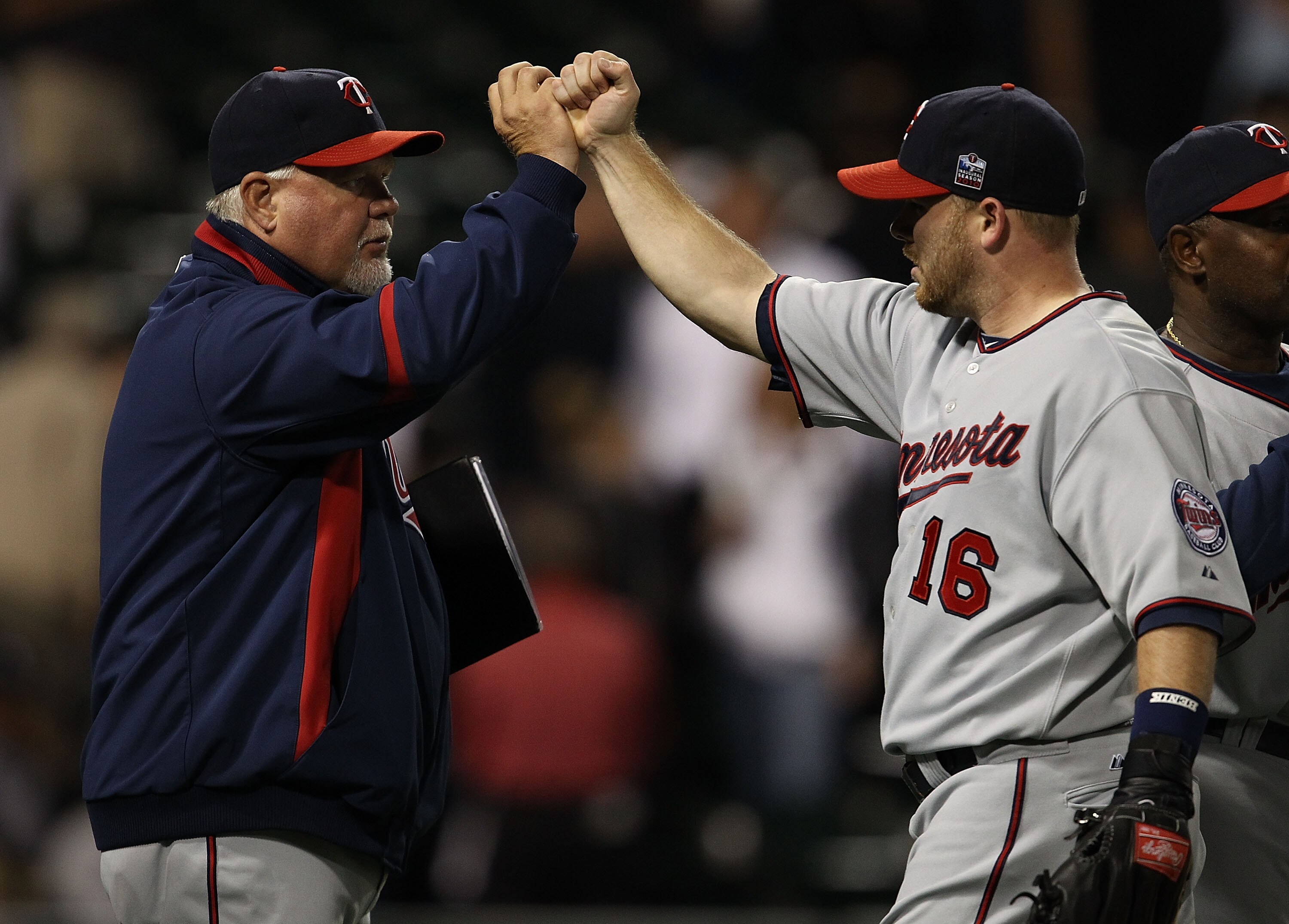 CHICAGO - SEPTEMBER 14: Manager Ron Gardenhire #35 of the Minnesota Twins congratulates Jason Kubel #16 after a win over the Chicago White Sox at U.S. Cellular Field on September 14, 2010 in Chicago, Illinois. The Twins defeated the White Sox 9-3. (Photo CHICAGO - SEPTEMBER 14: Manager Ron Gardenhire #35 of the Minnesota Twins congratulates Jason Kubel #16 after a win over the Chicago White Sox at U.S. Cellular Field on September 14, 2010 in Chicago, Illinois. The Twins defeated the White Sox 9-3. (Photo