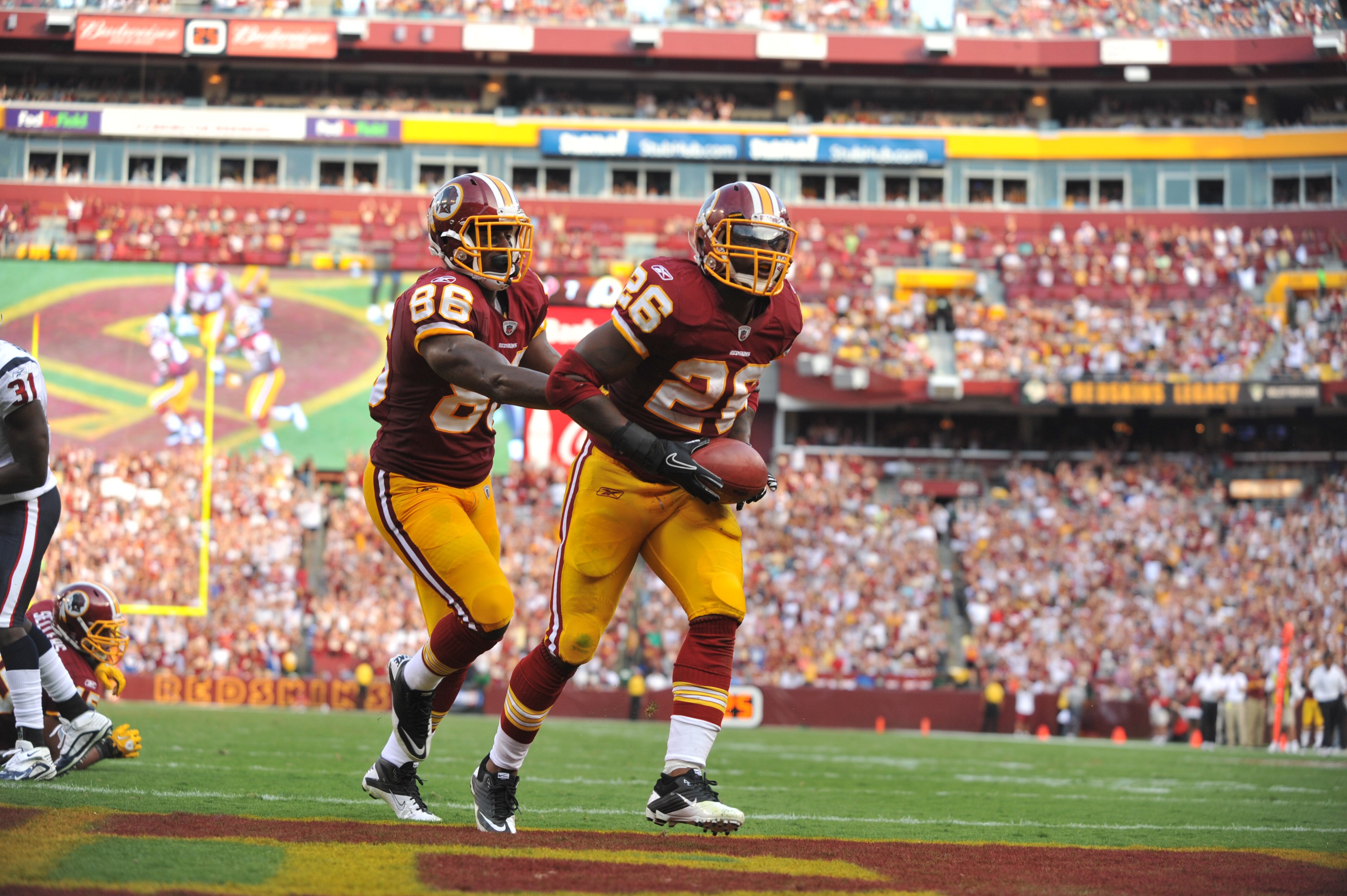 LANDOVER, MD - SEPTEMBER 19:  Clinton Portis #26 of the Washington Redskins celebrates a touchdown against the Houston Texans at FedExField on September 19, 2010 in Landover, Maryland. The Redskins lead the Texans at the half 20-7. (Photo by Larry French/