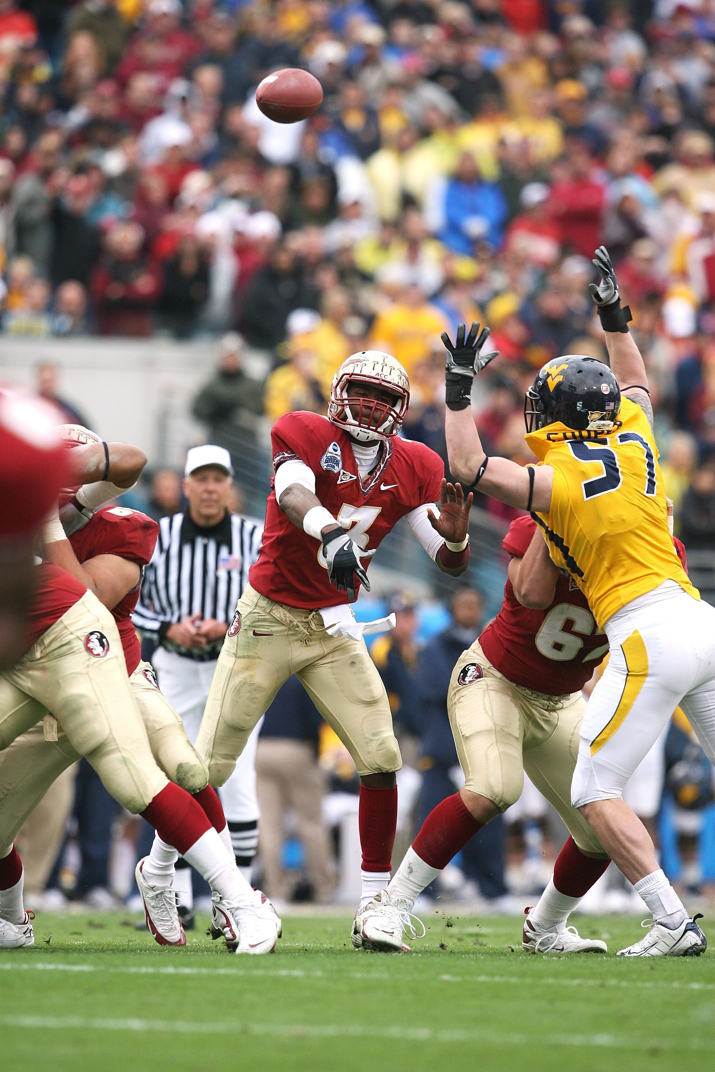 JACKSONVILLE, FL - JANUARY 01:  Quarterback E.J. Manuel #3 of the Florida State Seminoles throws a pass against the West Virginia Mountaineers during the Konica Minolta Gator Bowl on January 1, 2010 at Jacksonville Municipal Stadium in Jacksonville, Flori