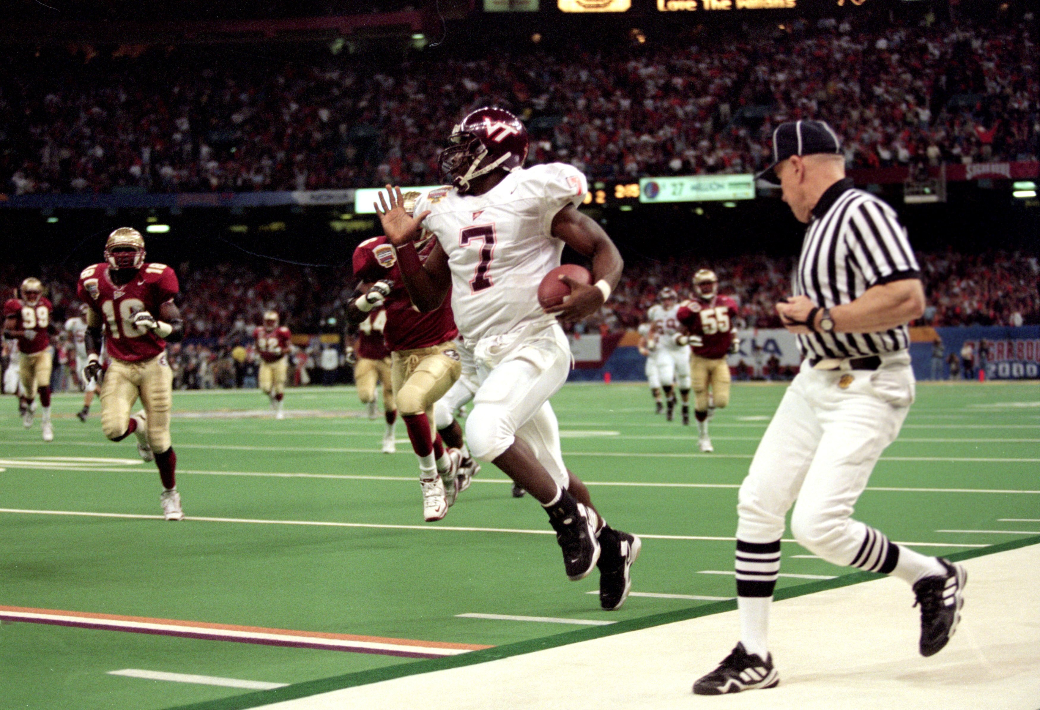 5 Jan 2000:  Michael Vick #7 of the Virginia Tech Hokies runs with the ball during the Nokita Sugar Bowl Game against the Florida State Seminoles at the Louisiana Superdome in New Orleans, Louisiana. The Seminoles defeated the Hokies 46-29. Mandatory Cred