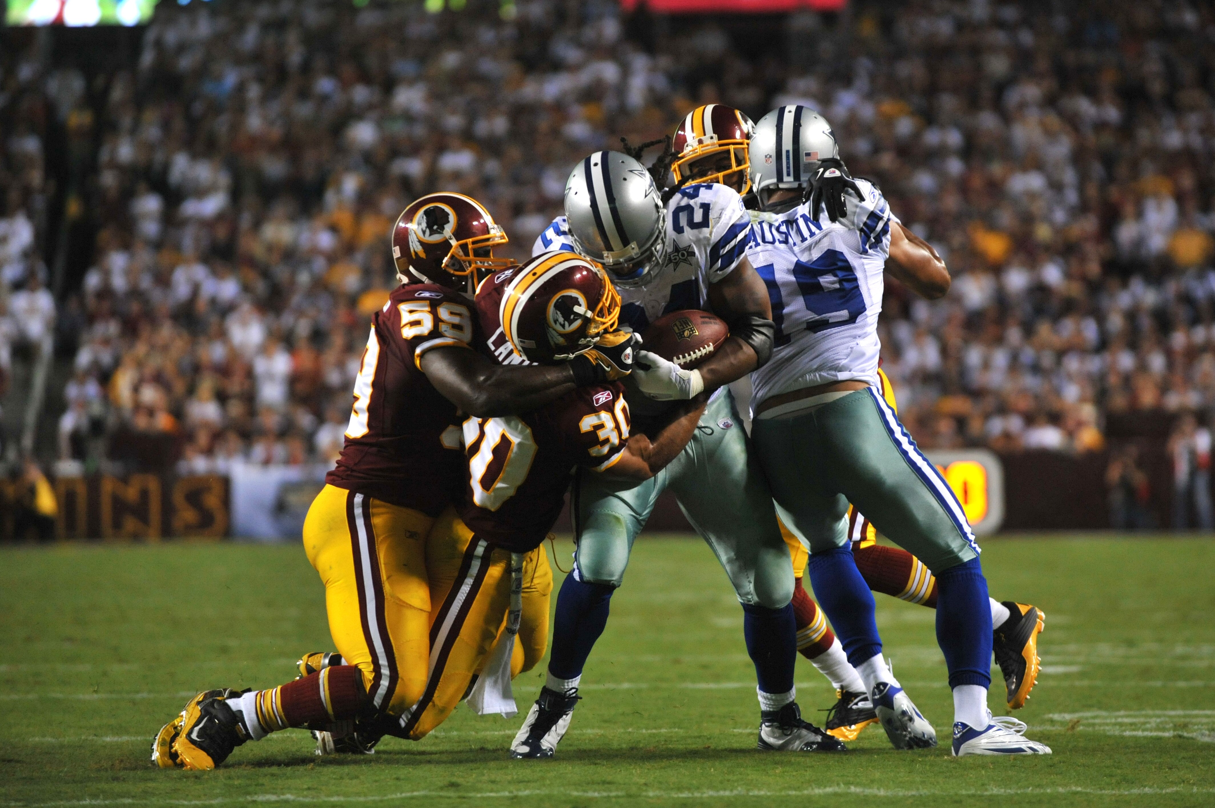LANDOVER - SEPTEMBER 12:  London Fletcher #59 of the Washington Redskins makes a tackle during the NFL season opener against the Dallas Cowboys at FedExField on September 12, 2010 in Landover, Maryland. The Redskins defeated the Cowboys 13-7. (Photo by La